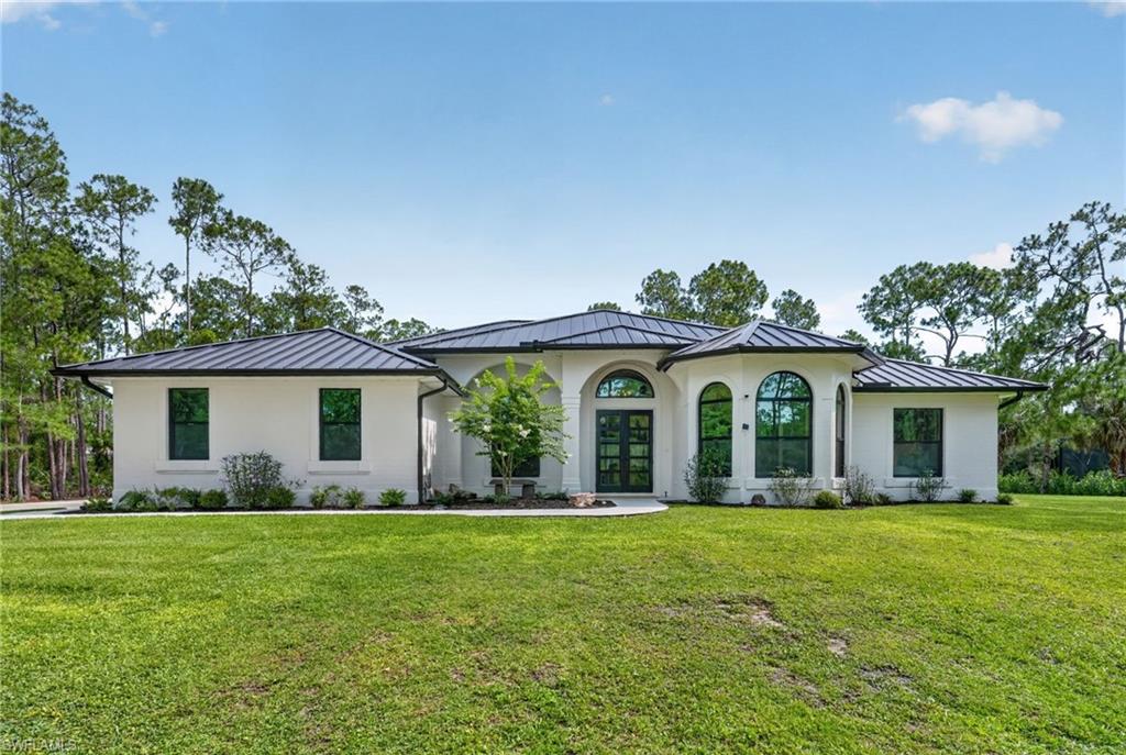 Nestled on a serene 2.73-acre lot in the sought-after Weber Woods neighborhood, this fully renovated estate perfectly blends timeless elegance with modern luxury.
Every detail reimagined, every upgrade intentional. A sanctuary where craftsmanship, tranquility, and privacy unite.
 
COMPLETE interior & exterior renovation Throughout:
All new ie:
Doors trim & baseboards
New 40x40 tile
New lighting, fans & fixtures
New interior & exterior paint
(walls, ceilings, doors, trim & baseboards)
New Reverse Osmosis water system
New metal roof (Fall 2025)
New hurricane impact windows (Fall 2025)
 
 
A top-to-bottom transformation where every detail has been replaced and upgraded - from roof to floors, inside and out. Move-in ready with modern upgrades and lasting quality. A "MUST SEE" of craftsmanship & luxury-level upgrades.
 
Concrete filled block, air conditioned hurricane shelter on property - that doubles for
living space with endless possibilities for
customization.
 
Exceptional attached 2 car and unattached 2 car garage  with an expansive
driveway boasting room for numerous vehicles,
Pool & Spa includes the following of ALL NEW EQUIPMENT ie:
saltwater chlorination system
energy efficient heat pump
high efficiency variable speed filter pump
automation system (in-house & phone app)
LED pool & spa lights
Pebble crete finish
glass tile
wood tongue & groove ceiling
 
4 bedrooms plus office and
3 bathrooms renewed top to bottom with new luxurious finishes
 
New Chefs kitchen with attached dinette, walk in pantry, and an adjacent formal dining room.
 
Ideally situated
minutes away - from dining and shopping to
beaches and the interstate
 
From the moment you step through the grand foyer to the serene views of mature trees
from every window, this home offers something truly rare - a completely renovated
estate on nearly 3 private acres in one of Naples' most coveted neighborhoods. Every
detail has been thoughtfully reimagined with premium materials, from Taj Mahal stone,
Dolomite and Calcutta marble bathrooms to custom and wood cabinetry and upgrades throughout.
Safety meets sophistication with a new metal roof, new Hurricane Impact windows and
double doors, electric hurricane shutters, and an on-site dedicated Hurricane shelter -
every layer of protection already in place.
Whether you're entertaining poolside, relaxing on the front porch, working from your
private office, or retreating to the spa-inspired primary suite, this property delivers an
elevated lifestyle at every turn.
Homes like this don't come along often. This is your opportunity to own a one-of-a-kind
estate where luxury, privacy, and modern living come together in perfect harmony.