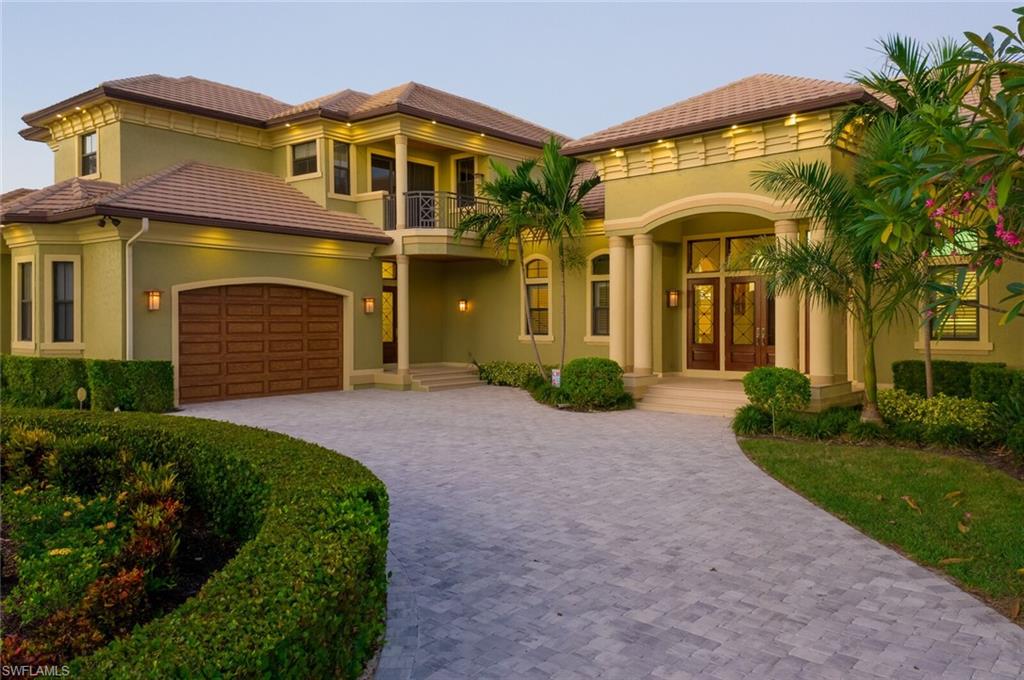 Experience waterfront living at its finest with this elegant and luxurious coastal home. This fully custom, resort-style residence is on a quiet street in Marco Island’s prestigious mini estates. It's a mile from the beach and 10 min to open water by boat. This flawlessly maintained dream home is move-in ready with masterful craftsmanship, unsurpassed quality and attention to detail, and available fully furnished. The home is decorated with sophisticated coastal flair featuring intricate bamboo and tile flooring, cake-tier, coffered and tray ceilings and one-of-a-kind painting. The home shows like a model and is ideal for entertaining with an open floor plan that seamlessly integrates living and dining with the perfect balance of SW Florida’s famous indoor/outdoor lifestyle. It has 4 beds and 6 baths. The home boasts a gourmet kitchen with 2 islands and dual kitchen appliances. The home also has a 4 car garage, theater, gym, whole-home generator, roof-top sun deck, heated pool & spa, and dock with boat and jet ski lifts. It has a fully integrated smart home system that controls indoor and outdoor lighting, climate, security, irrigation, and video feeds. Your island paradise awaits.
