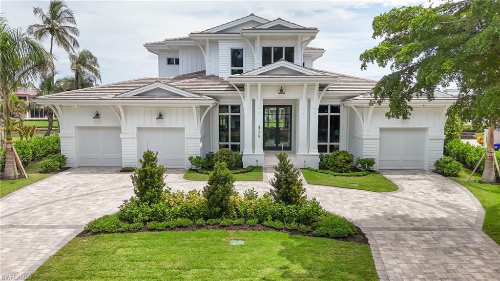 Located on a quiet cul-de-sac just moments from the beach, this extraordinary residence offers the rarest combination of luxury, location, and lifestyle—with no competition on the market.  Furnished and designed by Clive Daniel Home and built by Borelli Construction of Naples—one of the city’s longest-standing, family-owned luxury builders—this 6,250 sq. ft. home showcases exceptional craftsmanship and elevated design. Inside, you’ll find five en-suite bedrooms, separate powder and pool baths, plus a dedicated office, three-car garage, butler’s pantry with built-in coffee machine & double ovens, and an oversized food pantry with custom pullouts. Chef’s kitchen features high-end European style cabinetry and premium Wolf, SubZero and Bosch appliances. Thoughtfully designed for both beauty and function, the home offers a temperature-controlled wine room, two laundry rooms, a mud area, an elevator to all levels, abundant storage, and advanced technology including Crestron home automation, Lutron lighting, hardwired shades, built-in speakers, and security cameras. The primary closets feature electric pulldowns for maximum storage. A 1,000-gallon propane tank supports the whole-house generator for peace of mind. Elegant details abound—gorgeous millwork, European white oak floors, and curated designer finishes throughout. Outdoor living is unrivaled, with a built-in grill, double-sided fireplace, dual TVs in the covered lanai with retractable screens and shutters—all overlooking serene lake views and expansive yard space. The oversized pool and spa shimmer in the sun next to a built-in gas fire pit. This is more than a home—it’s a statement of uncompromising quality and exclusivity in one of Naples’ most sought-after neighborhoods.