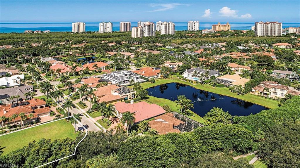 Ideal building lot located in one of the most sought after private Beach Club communities in Florida; Bay Colony. Nestled behind the gates of Bay Colony, this cul-de-sac location is the perfect setting for a custom home to be built. Beautiful plans are available from Harrell & Co. Architects.