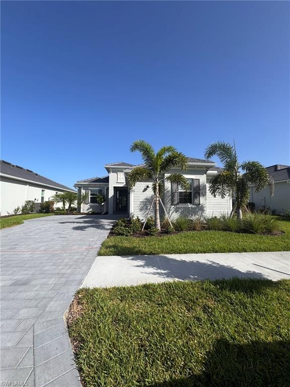 Welcome to this beautiful Victoria floor plan home located in the prestigious The National Golf & Country Club at Ave Maria. This thoughtfully designed residence offers an open-concept layout with spacious living and dining areas, abundant natural light, and modern finishes throughout. The gourmet kitchen features quartz countertops, stainless steel appliances, a large center island, and ample cabinet space, making it perfect for everyday living and entertaining. The private primary suite offers a generous walk-in closet and an elegant en-suite bathroom, while the additional bedrooms provide comfort and flexibility for family and guests. Step outside to the covered lanai and enjoy the peaceful Florida lifestyle with plenty of space to relax or entertain.

Residents enjoy exceptional resort-style amenities, including a championship golf course, resort-style pool, clubhouse, fitness center, tennis and pickleball courts, dining, and scenic walking trails. Conveniently located near shopping, restaurants, parks, and schools, this home offers the perfect blend of luxury, comfort, and the vibrant Ave Maria lifestyle.