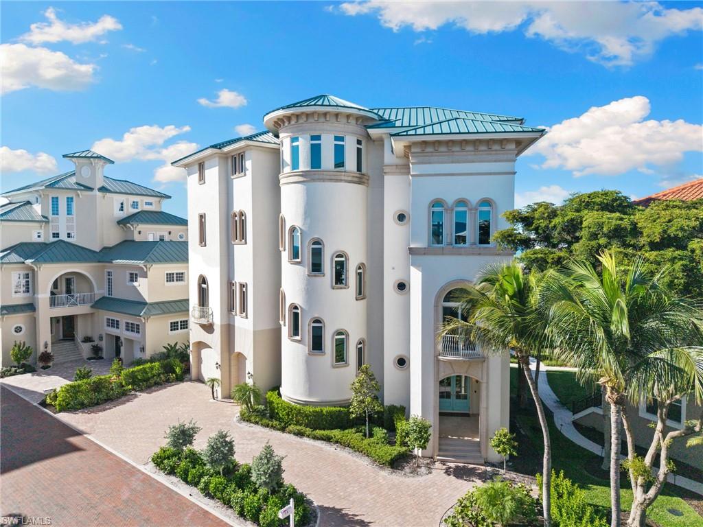 Elegance defined along the shoreline. This extraordinary beachfront residence captures the essence of refined coastal living with panoramic Gulf views and luxury woven into every detail. The entire fourth floor is dedicated to a private master sanctuary - an expansive retreat with a spa-inspired dual bathrooms, oversized closets with custom cabinetry and an open-air patio overlooking the breathtaking blue-green waters of the Gulf. Thoughtfully designed for both beauty and function, the home features a gourmet chef’s kitchen with two generous islands, Wolf and Subzero appliances with seamless flow into the main living spaces. Walls of impact-rated windows invite in natural light and endless water vistas, while an elevator ensures effortless access throughout the four floors of the home. Each of the four additional bedrooms features its own en-suite bath, giving family and guests a luxurious sense of privacy. A three-car garage provides ample space for vehicles, storage and beach essentials. On the primary living level, a covered lanai with an outdoor kitchen offers a stunning setting for entertaining with the Gulf as your backdrop. Just outside your door, an in-ground heated pool creates the perfect spot to unwind. Electric storm shutters offer added protection and peace of mind. Blending sophistication with coastal serenity, this exceptional home elevates beachfront living to an unparalleled level.