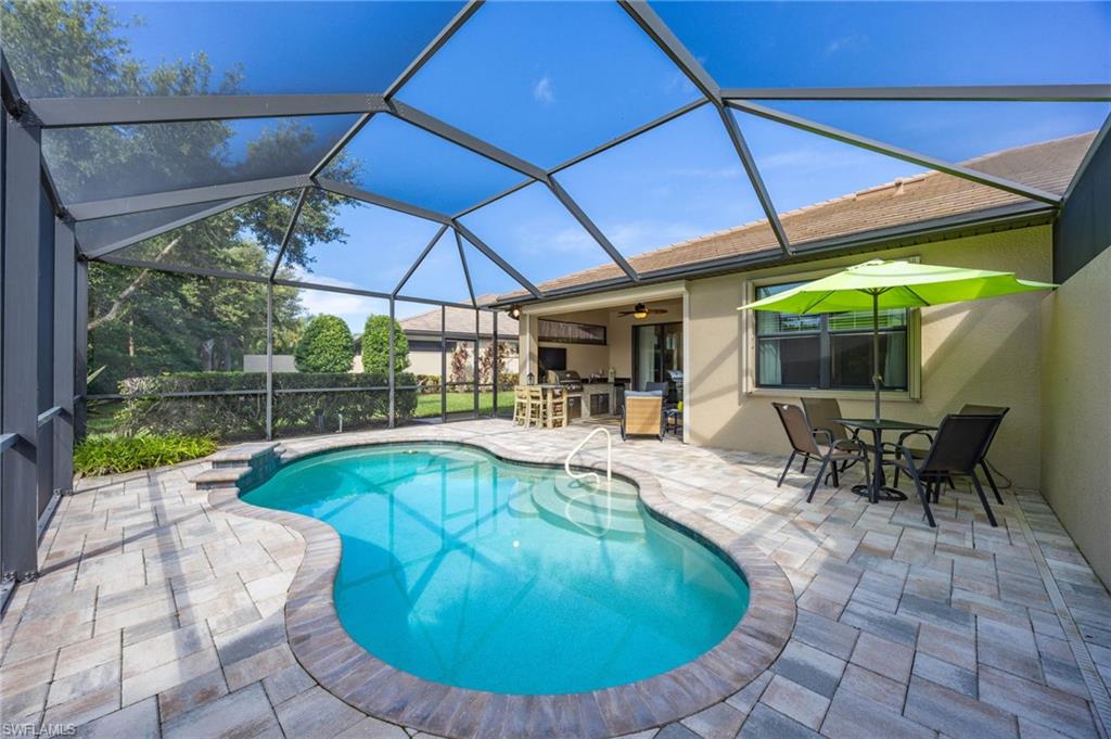 Welcome to your private paradise in the highly sought-after, resort-style community of Winding Cypress! This TURNKEY FURNISHED true 3-bedroom, 2-bathroom villa offers the ultimate blend of luxury, comfort, and effortless  living is move-in ready for your immediate enjoyment.
The 2-car attached garage—complete with convenient overhead storage racks and additional utility sink—offer great convenience.  Discover a bright, open-concept living space featuring seamless tile flooring throughout. The spacious great room flows effortlessly into your own private outdoor oasis. The enlarged screened lanai offers you enjoyment of a private pool and outdoor grill kitchen, located on a exceptionally private lot that offers a serene, peaceful retreat for relaxation or entertaining.
The owner’s suite serves as a tranquil escape, boasting elegant tray ceilings and an ensuite bath complete with a dual-sink vanity, a walk-in shower, a linen closet, and a generous walk-in closet. Two additional bedrooms provide ample space and privacy for visitors and guests.

Key upgrades and features include:
Brand-NEW HVAC Unit for year-round comfort and energy efficiency.
Storm Smart ELECTRIC STORM SHUTTERS on the rear lanai.
ACCORDIAN SHUTTERS on all exterior windows for ultimate peace of mind and storm protection.

Winding Cypress is renowned for its world-class amenities, including a resort-style pool, a resident-only restaurant, pickleball, tennis, bocce, a state-of-the-art fitness center, two dog parks, and a vibrant social calendar. Perfectly positioned just minutes from the award-winning beaches of both Naples and Marco Island, as well as shopping, dining, and entertainment, this property is an ideal choice for a full-time residence, a seasonal retreat, or a savvy investment option. Don't miss this rare opportunity to live the Florida dream!