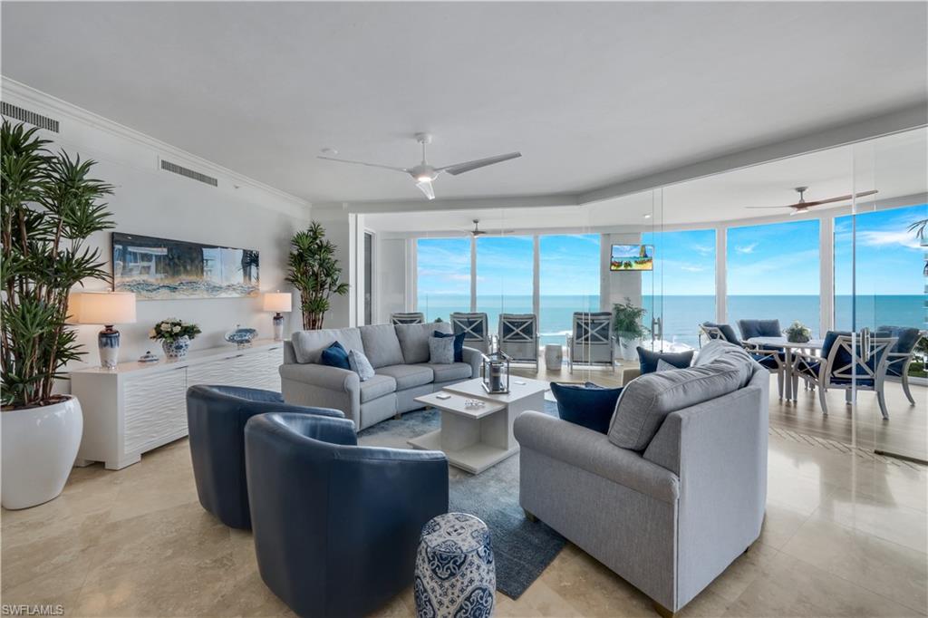 Experience the pinnacle of beachfront luxury at Seasons at Naples Cay in this stunning 8th-floor residence offering 4 bedrooms, 4 full bathrooms, and 1 half bath with breathtaking western exposure and panoramic Gulf of Mexico and white sand beach views. Thoughtfully renovated throughout, this exceptional home blends timeless elegance with modern sophistication.

The luxurious primary suite has been completely transformed with a beautifully redesigned spa-inspired bath featuring new flooring, custom cabinetry, mirrors, an oversized walk-in shower, soaking tub, and updated fixtures. The primary bedroom also features new flooring, while every bedroom has been updated with new flooring, custom closets, and its own private en-suite bathroom, providing comfort and privacy for family and guests alike.

Designed for both everyday living and entertaining, the residence showcases fresh interior paint, renovated guest bathrooms, a spacious office/den with new flooring and closet, a striking new gas fireplace with custom mantel and feature wall, and expansive living areas enhanced by a new full-glass threshold opening seamlessly to the lanai for uninterrupted Gulf and beach views. Double electric shades in the living room and lanai, along with new window shades throughout, provide effortless comfort and privacy.

The chef’s kitchen is beautifully appointed with new premium appliances, including a gas cooktop, double wall ovens, microwave, wine cooler, and a built-in coffee station, creating the perfect space for culinary enthusiasts.

Residents of Seasons at Naples Cay enjoy an unmatched resort lifestyle with world-class amenities including a beachfront pool and spa, state-of-the-art fitness center, tennis courts, social room, guest suites, 24-hour gated security, on-site management, and direct private beach access. Ideally located just minutes from The Ritz-Carlton, Naples, Mercato, Waterside Shops, and the area’s finest dining, shopping, and entertainment, this extraordinary residence offers the very best of Naples beachfront living.