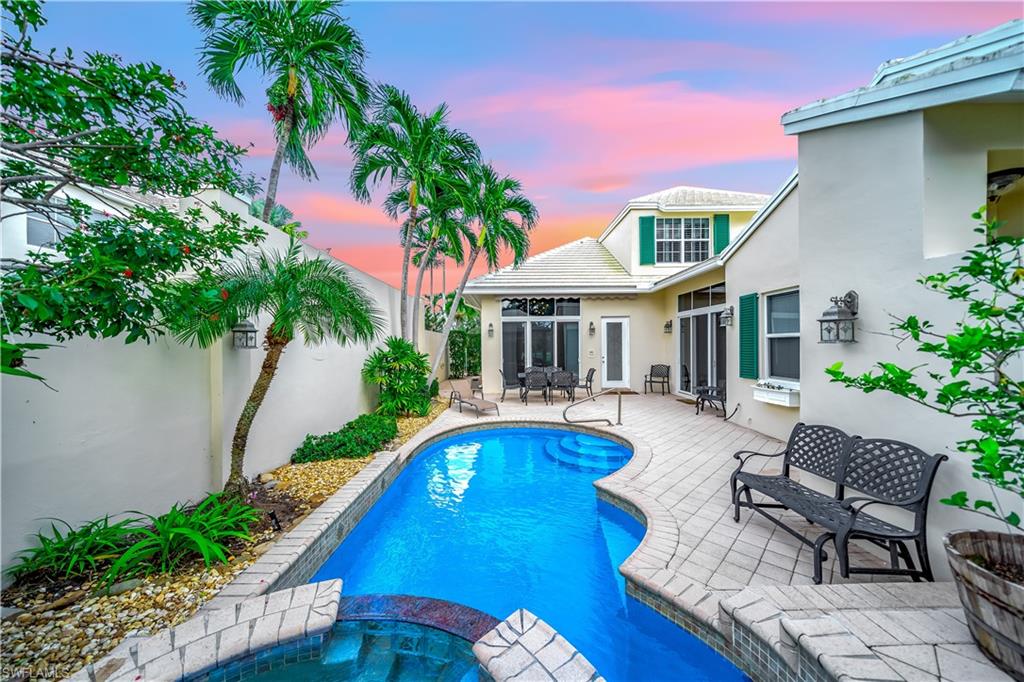 Welcome to this stunning 2-Story Courtyard Pool Home with 3 bedrooms, 2.5 baths and a 2 car attached garage perfectly set on the golf course with views of the 12th hole and a private pool with sunset views located in Boca Country Club. Enjoy country club living with Golf and an onsite restaurant without the requirement of a mandatory membership and high fees! Walking in the courtyard you are greeted by your own private oasis, pool, spa, and a seating area with a retractable awning perfect for al fresco dining complete with lush landscaping. Inside the natural light glistens the home. The volume ceilings make it grand and the mostly all impact windows and doors, with a newer roof and newer dual zoned AC make the home highly efficient. The kitchen is a chefs delight with light cherry wood cabinets, JennAir appliances, a spacious center island and ample storage. Walking into the dining and living room area there is a bar with a wine cooler, plantation shutters and views of the golf course. The primary bedroom is downstairs with an ensuite bath, dual sinks, a spacious shower with its own tankless water heater and a walk-in closet. Upstairs the other two large bedrooms share a bath in between. This home is perfect for everyday living and entertaining. Some furnishings are negotiable for an easy transition. Boca Country Club has a 24-hour manned gate and is ideally located near shopping, dining, and entertainment in nearby Delray Beach and Downtown Boca Raton. Accessible to the beach, major highways and airports. Come enjoy the lifestyle you have been looking for.