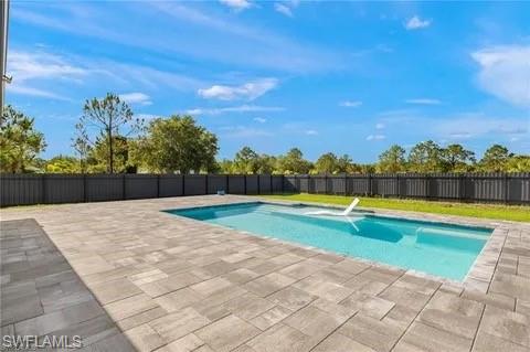 Built in 2022, this beautifully maintained 3-bedroom, 2-bath home is set on 1.14 acres of fully fenced land, offering a peaceful, rural lifestyle with plenty of space to breathe. Surrounded by larger parcels and open landscapes, this property provides the privacy and quiet that’s becoming increasingly hard to find—while still being within reach of everyday conveniences and areas experiencing continued growth and development.

The palm-lined, nicely landscaped front yard creates welcoming curb appeal. Inside, the home features a well-designed layout with a dedicated laundry room and utility tub, 2-car garage, and a whole-home reverse osmosis water system.

Step outside to your own private oasis—complete with a heated saltwater pool, expansive paver deck, and covered lanai—perfect for relaxing or entertaining in a serene, natural setting. The fully fenced acreage offers endless possibilities for outdoor living, recreation, or future enhancements.

A rare opportunity to enjoy newer construction, wide-open space, and the tranquility of rural living—while still benefiting from the momentum of nearby growth.