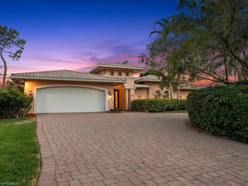 H.13129 - Live in the heart of Park Shore just minutes from everything that Naples has to offer!  Sitting atop an elevated, high and dry lot with lush, mature landscaping and concrete paver circle driveway, this wonderful home was updated in 2004 with stylish details and a flowing floor plan where you’ll enjoy memorable gatherings to last a lifetime. Pocketing sliding glass doors in the dining room/living room to the lanai as well as the large chef’s kitchen and built-in service bar makes your indoor and outdoor living and dining while entertaining guests seamless! Year around sun light fills the south facing screened in pool with stone waterfall, large concrete paver pool deck and covered lanai for gathering with friends and family. The owners’ suite offers lanai access, plantation shutters, dual walk-in closets and a luxurious bathroom. The three guest bedrooms with two bathrooms make this home suitable for overnight guests or for the young and growing family.  Extras: ample storage closets, hurricane protection for all windows and doors, 2-car garage & so much more!