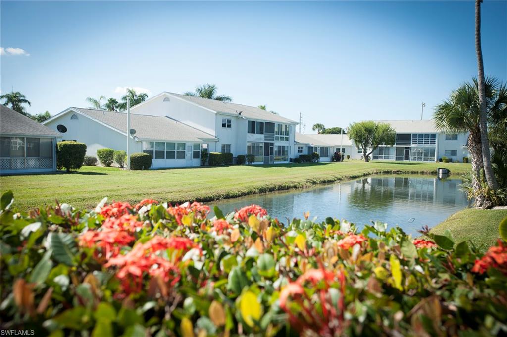 This ground floor, wonderfully designed, 1,200+ total sq. ft. condo, with windowed lanai overlooking the breathtaking lake view is a turn-key furnished home.   The pass through kitchen opens to the dining room and living room with views all the way to the lake, the little bridge to the clubhouse/pool and BBQ.  Spacious master bedroom with an on-suite updated bath, walk-in double closet area, and gorgeous lake views make this an inviting retreat.   The innovative home design captures your affections: all appliances included, 2 spacious bedrooms, 2 baths, block construction, and parking right at your door.  You will never want to leave this great South Ft Myers community, but you could spend your time at the Gulf of Mexico beaches, Sanibel  Island, restaurants, entertainment, and shopping all less than 15 minutes away.   The clubhouse & pool are just steps away in this great neighborhood, with very low real estate taxes, and low association fees. All this makes this condo-home a rated “Best Value Buy”.  Enjoy this active 55 plus Myerlee Community.  Move in Feb. 15th or after.