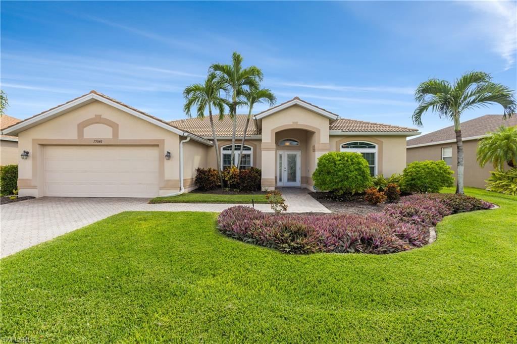 Stunning lakefront pool home in the remarkable gated community of Colonial Pointe! This conveniently located yet truely hidden gem is a quiet, family and pet-friendly enclave featuring only 72 residences and boasting low HOA fees of just $250 per quarter, no CDD, no special assessments, and no city taxes. This tasteful 3-bedroom plus den, 2-bath home offers a spacious split-bedroom layout with tile and luxury vinyl plank flooring throughout—and the beautiful furnishings are negotiable!  The lakefront backyard is a true tropical oasis highlighting a custom saltwater pool added in January 2023 with dual solar and electric heaters, a variable speed pump, and an expansive screened lanai with southern exposure for premium sunning.  Enjoy 365-day peace of mind with a home security system, hurricane impact windows and doors, plus a motorized roll-down shutter to protect your outdoor patio furniture. The interior reveals a neutral palette with tropical accents and abundant natural light flows throughout.  The primary retreat features a bay window-sitting area, private access to the lanai, a walk-in closet plus an additional closet, and a large en-suite bathroom with a Jacuzzi soaking tub, separate shower, dual vanity, and a separate water closet. The designer kitchen boasts upgraded wood cabinetry, beautiful granite countertops, stainless steel appliances, and an attractive breakfast nook overlooking the pool.  In addition to the primary suite, there are two comfortable bedrooms with a full bath in between. The den is currently utilized as an exercise room but could easily become the perfect remote office. Additional highlights include a separate laundry room plus pantry and storage, a large two-car garage complete with an EV charging station. The home's well-maintained landscaping has a private well for cost-effective irrigation. Uniquely located just minutes from downtown Fort Myers, and the beaches of Sanibel/Captiva, & Fort Myers Beach. Nearby to RSW airport, regional airports, local parks, entertainment, dining, offices, shopping and healthcare. The choices are yours - a permanent place in the sun, a winter hideaway, or an excitng investment with significant rental potential!