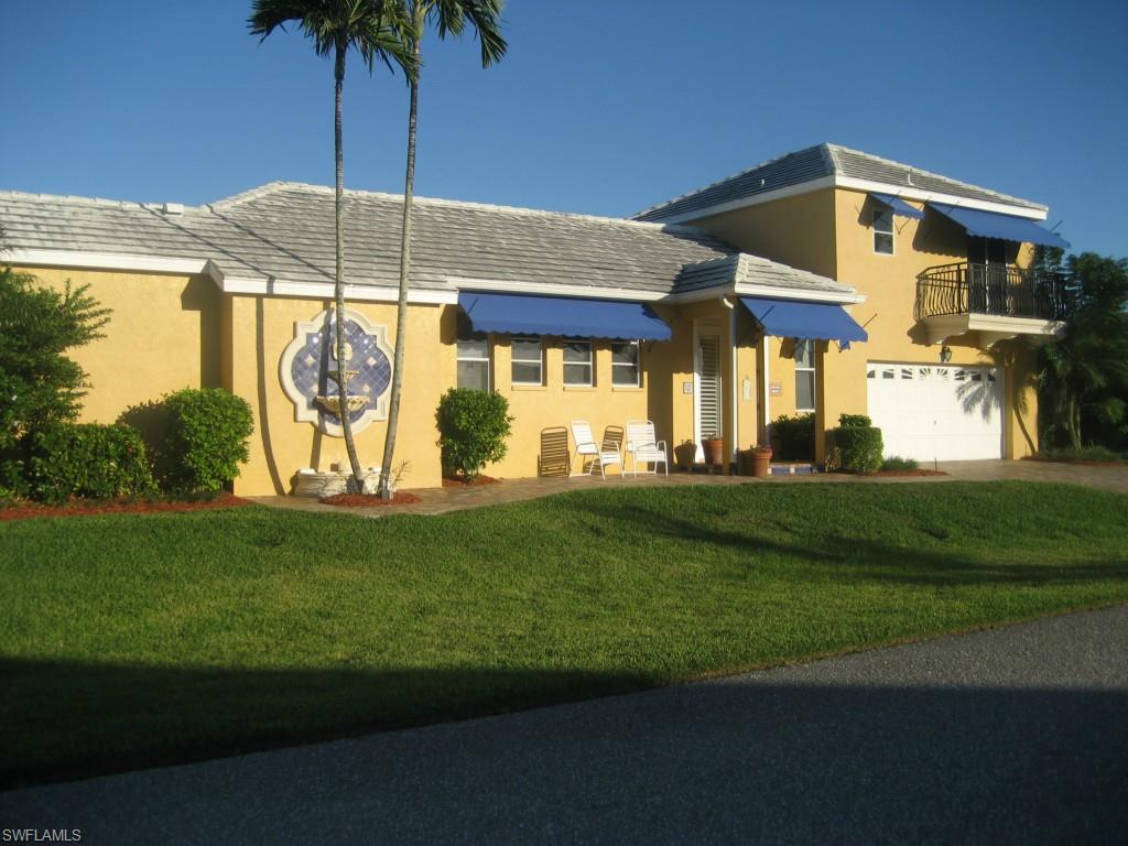 Very unique home in lovely SAVONA neighborhood.  Large caged and heated pool with waterfall and vary spacious lanai area.  Beautiful large corner lot and lushly landscaped.  Plenty of privacy, vinyl fence and iron fence and balcony.  Brick paver driveway, walk way, and patio out back. Master bedroom, office, living room, dining room, family room, kitchen and pool bath are downstairs.  Other bedrooms/living area and remodeled bathroom are upstairs.  Upstairs has its own entrance from the outside and the lanai.  Perfect in law or guest suite. So many upgrades to include for the outside: electric shutters w/remotes, outside fountains, balcony, deck (12 x 16), fruit trees.  Security gates, and security lights.  Inside there are custom moldings around windows with pretty "rosette' design, crown molding, upgraded baseboards, plantation shutters, tile floors, wood floors, full body walk in shower in master, tub.  Plenty of cabinets in the kitchen. Mantabloc plumbing system (5/14), pool equipment (7/14).  Separate A/C for master suite. Potting station and outside area for growing orchids or herbs.  Huge remodel was done just a few years ago.  Stunning home, this is a must see!