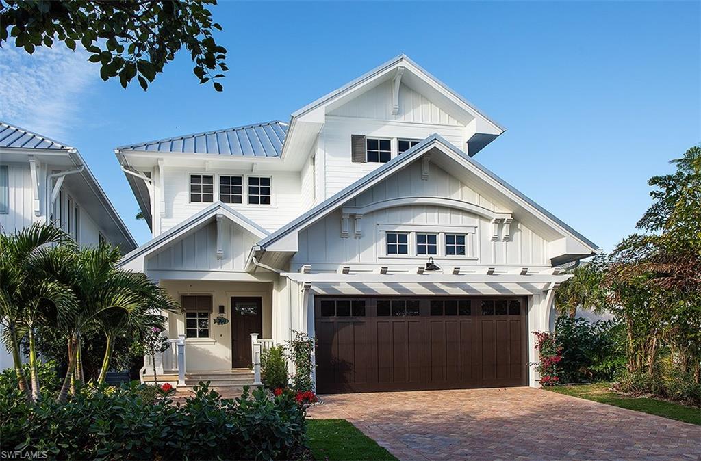 Introducing the Cottages Off Fifth, a luxuriously appointed and furnished single-family residence nestled along Park Street, just steps to the famed 5th Avenue South Shopping and Dining District, the renowned tennis facilities of Cambier Park and the pristine beaches of Old Naples. Penned by MHK Architecture & Planning, built by Lotus Construction, LLC and masterfully appointed by Clive Daniel & Calusa Bay Designs, this 3-bedroom plus den residence features a ground floor master suite configuration, spacious 2nd floor loft area and spectacular outdoor living space complete with private pool and spa, custom designed wet wall feature, outdoor wood burning fireplace, western exposure and lake view. Featuring “farmhouse chic” design elements, this home offers the finest interior and exterior appointments. Construction features include (but not limited to) CBS construction for all floors, Andersen impact windows,Wolf/SubZero appliances, direct natural gas feed, custom Ruffino cabinetry, energy efficient spray-insulation & automated patio screens.