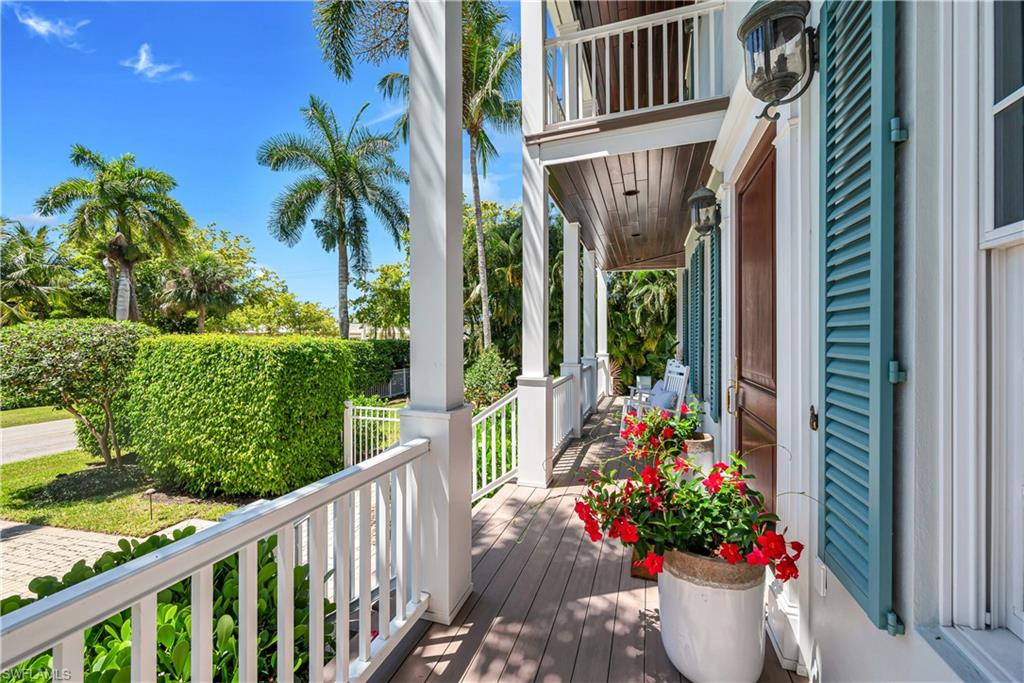 FABULOUS OLDE NAPLES LOCATION! Walk to the beach, shops and restaurants on Third Street by stepping onto your front sidewalk and making a turn or enjoy the Gulf breeze and delightful neighborhood while sitting on one of the many verandas! This pretty residence features numerous updates including a new metal roof, a gourmet kitchen by A. Vernon Allen, beautifully renovated baths, new decking and railing on the many wide porches as well as pool/spa updates including a new heater and coping.  The rich wood flooring, classic plantation shutters and two fireplaces provide further architectural interest to this most inviting home.