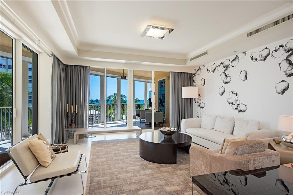 Surrounded by tropical greenery, this bright and cheerful 5th floor residence offers glistening south, west and east views. Ten foot ceilings and window walls of glass create a light filled environment. The smartly designed contemporary interior further enhances the feeling of tropical sophistication. This residence lives like a single family home with an open floor plan offering ample spaces to gather with family and friends and private places to get away. With almost 4,100 square feet offering four bedrooms, three full baths, a spacious living room, dining room and gracious family room. Two screened and shuttered lanais and a unique open-air terrace provide dazzling sunsets and city lights. Two 1st level parking spaces and air-conditioned storage are included. This is the perfect move up residence in one of Park Shore’s finest buildings featuring a host of amenities including a beachfront pool, gracious social room, private dining room, billiard room, state-of-the-art fitness center with men's and women's spas with steam, sauna and a massage room, two elegant guest suites and 24 hour security. This pet friendly community allows two household pets of any size.
