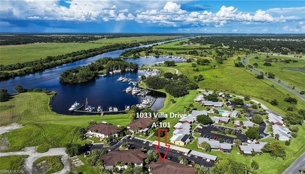 Located next door to the Port LaBelle Marina the Villas at River Run are a hidden gem in the LaBelle area! This 2 bedroom 2 bath ground floor unit is perfect for anyone wanting an easier, affordable lifestyle. This unit features a private courtyard area + a screened lanai, and is just steps from the community gazebo and barbeque grills.  This is ideal for boaters being adjacent to the Marina for your boat! This unit is going to need some TLC, but is priced to sell.