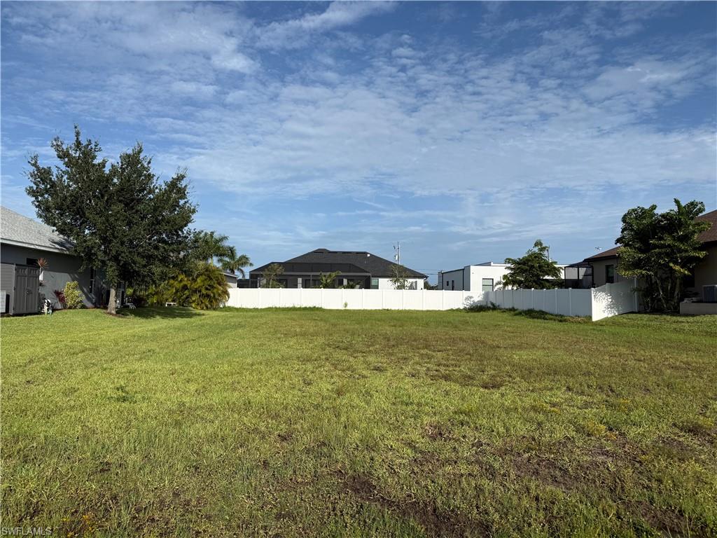 Build your Florida dream home on this *PRIME VACANT LOT* with *WESTERN REAR EXPOSURE* located in the highly desirable and rapidly growing NW quadrant of Cape Coral! Perfectly positioned in a quiet, modern neighborhood, this high-demand building site features *CITY WATER & SEWER UTILITIES ALREADY IN PLACE!*. Located in close proximity to Pine Island Rd and the future Seven-Islands project.