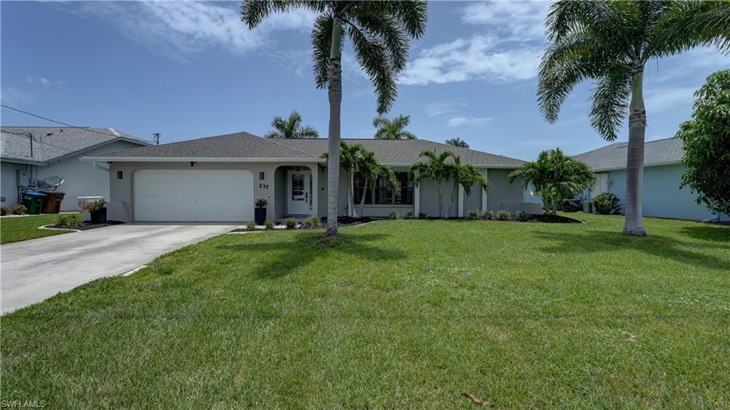 Welcome to your dream home in Cape Coral! This stunning single-family home boasts 4 bedrooms, 2 bathrooms, and a 2-car garage, perfect for families of any size. The in-ground pool is ideal for relaxing on hot summer days, while the granite counters and stainless steel appliances in the kitchen make cooking a breeze. With a mix of carpet and tile flooring throughout, this home is both cozy and easy to maintain. The wide fresh water canal offers beautiful views and a peaceful atmosphere, perfect for unwinding after a long day. This home is clean, move-in ready, ensuring a modern and stylish living space. The concrete dock is perfect for fishing or simply enjoying the serene waterfront views. Located in a quiet neighborhood, this home offers privacy and tranquility, making it the perfect retreat from the hustle and bustle of everyday life. Don't miss out on the opportunity to make this your forever home!
New Roof, 08-2024, New Impact Entry Door 02-2024, AC Replacement 06-2020.
This is a very well kept home that is Move-In-Ready. Bring your Buyers!!!