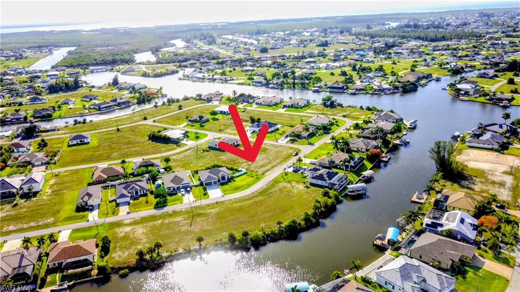 Build your dream home on this beautiful 1/4-acre vacant lot in Cape Coral! Located in a great neighborhood,
this property offers an excellent opportunity to invest in one of Southwest Florida’s most desirable areas.
Situated across the street from waterfront properties, you’ll enjoy the feel of a premium location without the
waterfront price tag. The surrounding area features well-maintained homes, peaceful streets, and convenient access to shopping, dining, schools, parks, and everything Cape Coral has to offer. Whether you’re ready to build now or looking to secure land for the future, this lot is a fantastic option in a growing community. Don’t miss your chance to own a piece of paradise in Cape Coral!