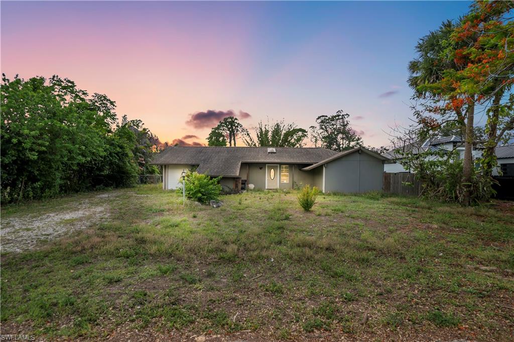 Introducing this charming 2-bedroom, 2-bathroom fixer upper! Nestled on a generous half-acre lot in a desirable community of Lehigh Acres. Location is key with this property. This home is awaiting your personal touch. It includes a convenient attached one-car garage and a fenced backyard, complete with a two-story (unfinished) shed. This home presents endless possibilities for customization and expansion. Don’t miss the opportunity to customize this home to live in it, or for investment!