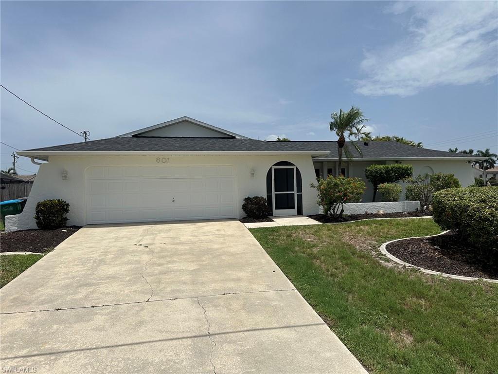 Discover the relaxed Florida lifestyle in this charming 3-bed, 2-bath pool home in Cape Coral’s beloved Unit 64. Perched on a high-elevation corner lot, the home stands out immediately with fresh, light exterior paint, bold black shingles, and vibrant tropical landscaping that creates a picture-perfect first impression.

Inside, you’ll find spacious rooms, oversized closets, and a soothing palette of coastal greys and whites. The home has been thoughtfully updated and styled with vacation-rental appeal - bright, breezy, and ready for guests or full-time living.

The oversized garage, impact window protection, new 2022 roof, and 2022 AC Unit add comfort and confidence, while the property’s elevation keeps this flood insurance low and transferable. This home stayed dry during the surge that affected nearby areas, making it an even more desirable option for buyers seeking peace of mind.

The screened-in pool and expansive covered lanai create a true outdoor oasis - perfect for morning coffee, afternoon swims, or evening gatherings. Located just south of Cape Coral Parkway, you’re minutes from The Westin, Tarpon Point Marina, waterfront dining, boat ramps, and some of the most coveted Gulf-access neighborhoods in the city.