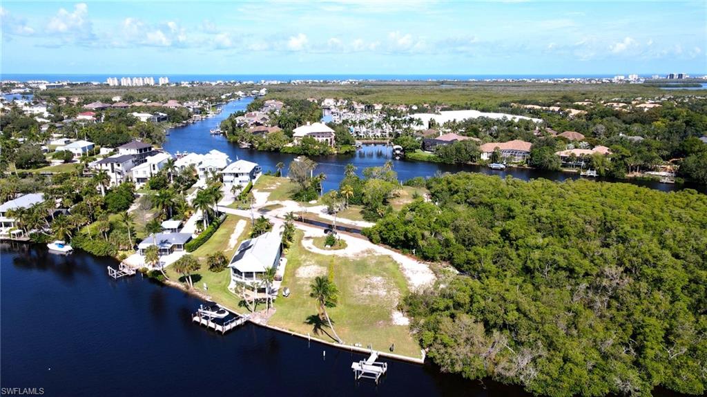 One or more photo(s) has been virtually staged, AI generated or rendered.  Rare direct Gulf access waterfront lot in one of Bonita Springs' most desirable locations, offering an exceptional opportunity to build a brand-new duplex or custom waterfront home. Existing improvements include a concrete seawall, private boat dock, and boat lift, providing direct, no-bridge Gulf access. Just minutes from Bonita Beach, premier shopping, dining, and entertainment, this prime homesite offers the ideal blend of waterfront living and investment potential. Whether you're a builder, investor, or future homeowner, this is a rare opportunity to create a custom waterfront property in one of Bonita Springs' most sought-after locations.