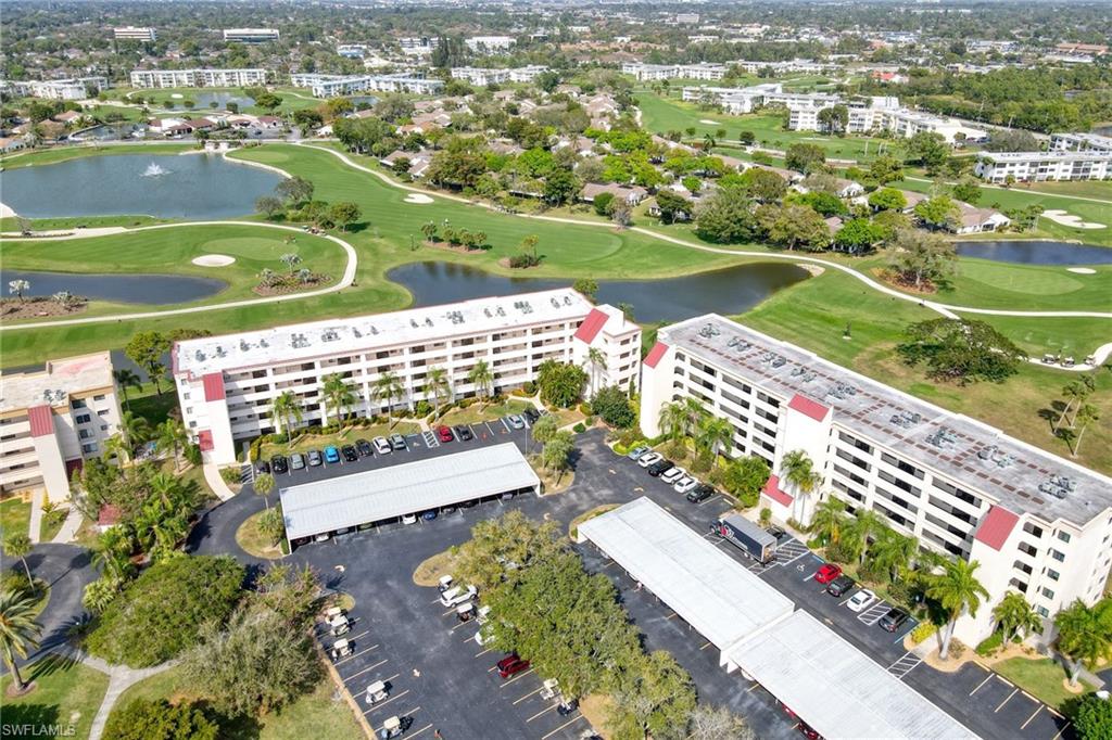 Stunning 2 bedroom 2 bath with golf course and lake views. Updated kitchen with tons of cabinet space and granite counter tops and backsplash. Soft close doors on cabinets, kitchen appliances 1 yr old. Recessed lighting. Hardwood flooring in living room. Raised bath room vanities in both bathrooms, screened entry way. Unit comes partially furnished and UNIT INCLUDES HIGHLY SOUGHT AFTER CARPORT GOLF CART SPACE AND BONUS GOLF CART!!! Sliders from living room and master bedroom to lanai. Seven. Lakes 55+ community offers unlimited golf with no green or trail fees, 6 heated pools, tennis courts, pickle ball, bocce, on site restaurant,  wood shop,  hobby room and so much more. Centrally located to shopping, restaurants and RSW airport and Ft Myers Beach.