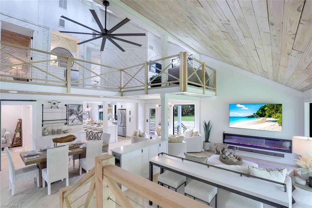 Welcome to this one-of-a-kind 4 bedroom Coastal Cabin! Located on a 2.73 acre parcel and just 6 miles from the beach, this completely designer remodeled home is the perfect opportunity to live the laid back lifestyle yet be just minutes from modern conveniences. As you make way up the secluded pathway, you'll gain an immediate sense of peace and relaxation. Enter into this tranquil retreat and let the natural beauty sink in. Your eye will be drawn to the vaulted wood ceilings, custom staircase, beautifully designed seating spaces and the large impact glass windows that offer an abundance of natural light. Start your day with a cup of freshly brewed coffee, overlooking the private wildlife sanctuary and take in whatever mother nature has in store for you today. Later, invite close friends over for an intimate dinner utilizing the newly remodeled chef's kitchen featuring quartz countertops, soft close cabinets and induction cooktop. End the day in your most magnificently redesigned master ensuite boasting a luxurious ambiance. The guest bedrooms feature their own private loft spaces and the home even comes complete with a doggie den under the stairs.
