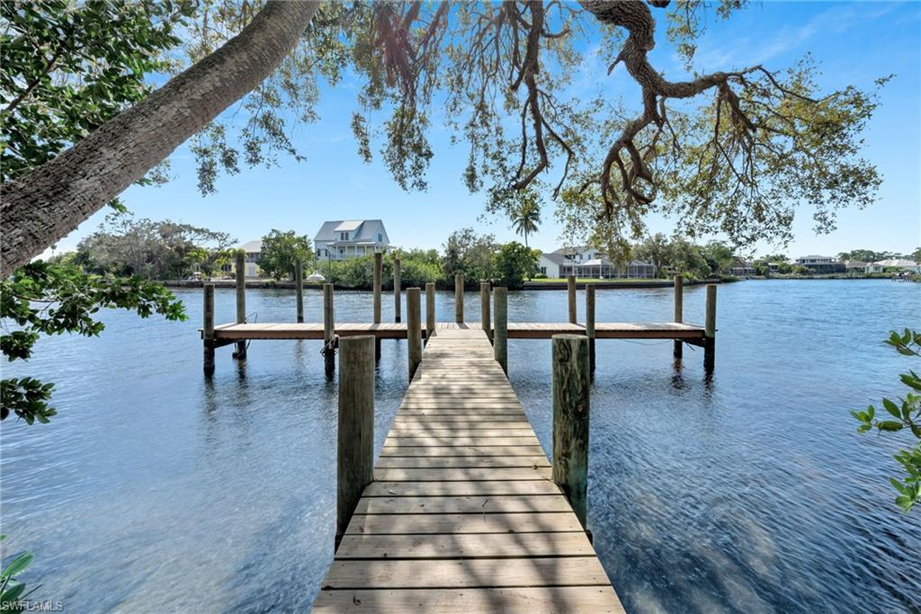 Boaters paradise.  Imagine a grand riverfront estate in the Hidden Harbor neighborhood of Bonita Bay. Upon entering, you're greeted by a spacious foyer. The main living area boasts an open floor plan, featuring large windows that frame views of the Imperial River. The gourmet kitchen is equipped with a gas cooktop and a breakfast nook offers a casual dining area, while a formal dining room provides an elegant setting. The bedrooms all have private baths. An additional bedroom and flex space offer the ideal spot for an exercise studio and home office. The owner’s suite is a luxurious haven, with spa-like ensuite bath. A game room and movie theater complete the offerings in this amazing residence. Outside, the expansive lanai with pool allows for access to the beautiful views with a cabana with outdoor kitchen and pool bath. A firepit is perfect for toasting s’mores and a private 40-foot dock on the Imperial River offers gulf access. Bonita Bay offers a private beach club, miles of walking trails, three parks, pickleball, bocce ball, on-site marina and optional membership at The Bonita Bay Club offering 5 golf courses, championship tennis, state-of-the-art fitness and spa, and more!