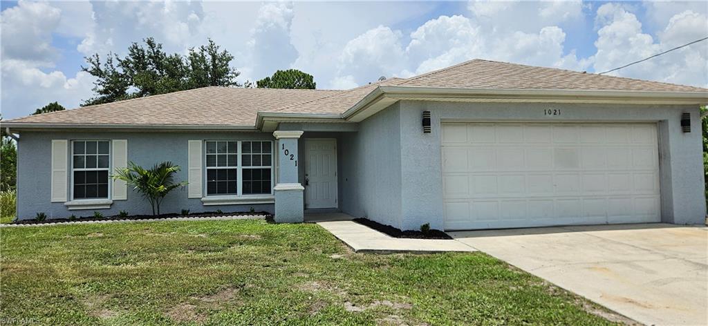 Move right into this well-maintained 3-bedroom, 2-bath rental home in Lehigh Acres! This move-in-ready home features a spacious 2-car garage, vaulted ceilings, and a functional built-in desk area that's perfect for working from home or staying organized. Enjoy the large open patio overlooking a private backyard, offering plenty of space to relax or entertain.