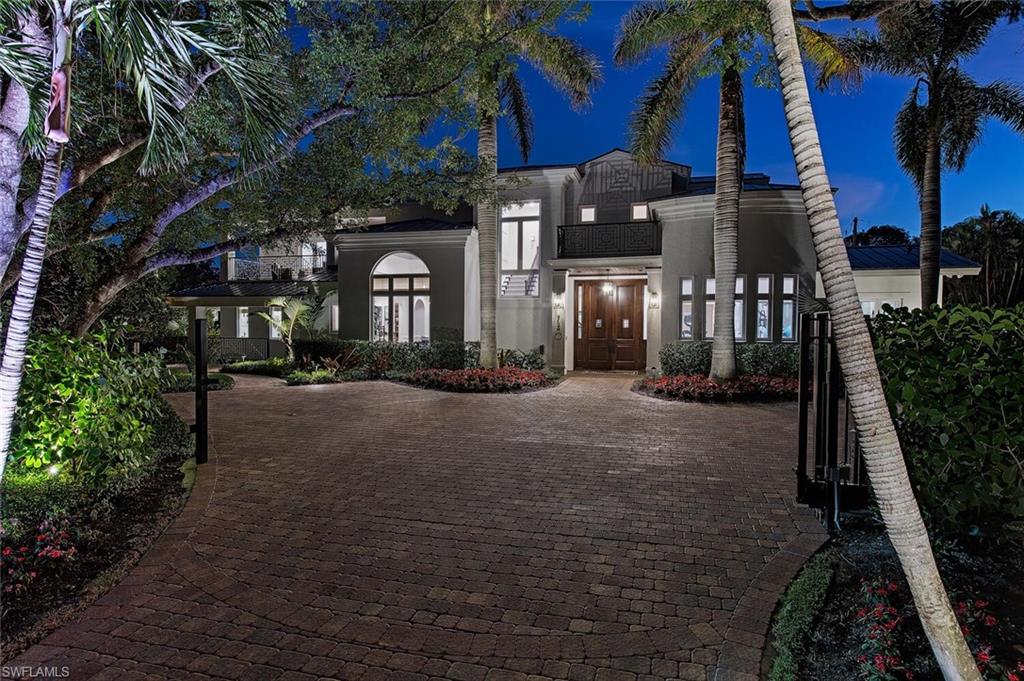 740 Coral Drive is situated in a picturesque location on an oversized lot right in the heart of Coquina Sands offering ideal proximity to all the best of what Naples has to offer including Old Naples, beaches, Venetian Village, Waterside shops, and the upcoming Four Seasons Resort. London Bay Homes remastered this property in 2020 to exacting standards as well as a new standing seam metal roof in 2022 and the home lives like new. Residence consists of nearly 6,700 square feet of living space, 4 bedrooms, 8 baths, gourmet kitchen, service kitchen, great room layout with wide plank walnut wood flooring, den, 2nd study/exercise flex, separate living room, huge laundry, mud room, generous first floor guest retreat with private courtyard, 3 bay air conditioned garage, immense storage, and a massive lavishly appointed spa like master bedroom offering his/hers baths and two additional bedrooms with extensive balconies upstairs. Outside you will find generous covered living space with kitchen, large heated pool/spa with sun shelf, pool bath, outdoor kitchen, fire pit, and automatic roll down screens. Grounds are immaculate and extremely private with exquisite fenced in landscape.