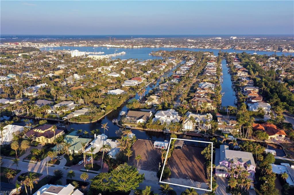 !!!WITHOUT A DOUBT THIS IS THE BEST WATERFRONT BUY IN ALL OF NAPLES!!! Check out the SIZE of this DIRECT ACCESS HOMESITE! !!! .38 ACRES !! WITH A "GRANDFATHERED" COVERED BOAT SLIP !! You can walk to Third Street South and the BEACH in minutes!! PLUS, the sellers did it for you: The home has been torn down and you can get a great feel for the breadth and width of this fabulous home site! BUILD YOUR DREAM HOME!!! The most perfect LOCATION LOCATION LOCATION in all of Naples! Situated around the corner from the beach at 18th Avenue South, and a short stroll to all the fine dining options, world-class galleries, amazing shopping, a fantastic farmer's market and so many fun events on the famous Third Street South. Best of all, keep your boat in your own backyard...Did I mention the covered boat slip which creates so much value!?! There are NO bridges to Naples Bay and the Gulf of Mexico! YES, this is the best of ALL worlds! The possibilities are endless. Overlooking Sanderling Cove, the eastern exposure is wonderful.