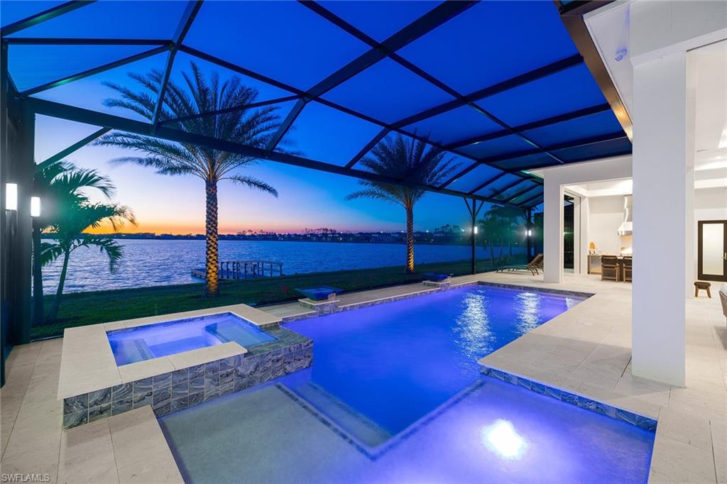 Newly built designer decorated custom home by renowned builder, Seagate. The Calabria model offers a serene West Indies and coastal atmosphere. Picturesque western exposure showcases the most gorgeous panoramic waterfront sunsets. Enjoy private direct access boat dock on the 352 acre Lake Como. Well-planned and flowing open-concept spaces with volume ceilings. Stunning gourmet kitchen offers highly sought-after gas burners. Expansive and private master suite with breathtaking lake and sunset views, lanai sitting area with outdoor fireplace, and luxurious spa-like bathrm. Spacious guest suites feature beautifully appointed en-suite bathrms. Large covered lanai with outdoor kitchen and motorized rolldown screens. Relaxing pool with spa and sun shelf. Esplanade Lake Club is a private, gated waterfront community that offers a low-maintenance lifestyle. The luxurious clubhouse offers resort-style amenities such as pool, lakeside beach, spa, restaurant, bar, fire pit, spa facility, boat docks, kayak launch, pickleball, bocce ball, tennis, dog parks, and playground. $386,000 in upgrades over original purchase. Whole house natural gas automatic generator.