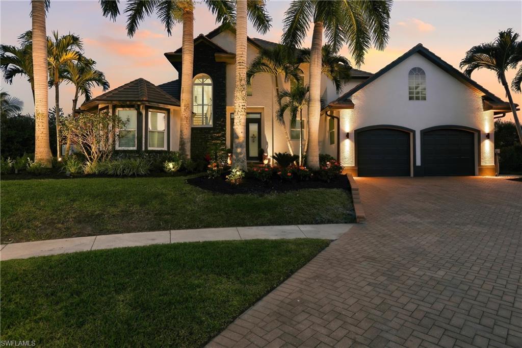 Beautifully Renovated Waterfront Home in Marco Island!!! Featuring 141 feet of seawall on a key lot with wide water views and southern exposure. Enjoy quick Gulf access through one bridge with 14-foot clearance into Smokehouse Bay. Private dock with boat lift. Located on a quiet court surrounded by Newer homes and just six blocks to Residents’ Beach and Mackle Park, plus close to shopping and dining. Interior highlights Include Soaring Ceilings, Custom Fireplace, 2x4 porcelain tile flooring throughout, and a Gourmet Kitchen with Upgraded appliances, Custom cabinetry, and Large center island. The main-level Primary Suite offers a sitting area, custom walk-in closets, and a spacious bath with soaking tub, Walk-in shower, and dual vanities. Upstairs features 2 Additional Bedrooms with balcony access and a flexible Den ideal for office, gym, or game room. Newly Screened lanai with Heated pool, Lounge and BBQ area. Additional features include 2-zone HVAC, whole-house generator, water softener system, wine display area, professional landscaping and lighting, and 2-car garage. Furniture and boat negotiable. Exceptional waterfront opportunity at a great value. Other Great Features: Amazing Sunsets, Exterior Freshly Painted, Professional Landscaping, 141ft of Seawall with wide water views, Move in Condition and on Fantastic Lot & More..