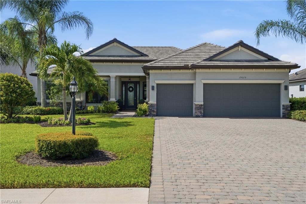 Welcome to 19079 Elston Way, located in one of Estero’s most sought after communities and offering a beautiful lake view with highly desirable southern rear exposure. Tucked away on a quiet street toward the back of the community, this well maintained Oakmont II floor plan offers the perfect blend of comfort, space, and Florida living.
With 2,361 square feet of living space, this popular floor plan features 3 bedrooms plus a den that can easily serve as a 4th bedroom, 2.5 baths, and an open layout that is ideal for both everyday living and entertaining. Offered turnkey, this home provides an easy opportunity to move right in and start enjoying everything Southwest Florida has to offer.
The spacious living area features a custom built entertainment wall with a fireplace, creating a welcoming focal point for family gatherings and relaxing evenings at home. A three car garage provides plenty of room for vehicles, storage, golf carts, and beach gear.
Step outside and enjoy peaceful lake views from your backyard. The generous homesite offers plenty of room to add a custom pool and create your own outdoor oasis. Southern exposure provides great natural light throughout the day and excellent sun on a future pool.
Residents enjoy access to outstanding community amenities, including a resort style pool, fitness center, tennis and pickleball courts, restaurant, café, playground, dog park, and a full calendar of social activities.
If you’ve been looking for a move in ready home with a great view, desirable exposure, room for a future pool, and an unbeatable community lifestyle, 19079 Elston Way is a home you won’t want to miss!