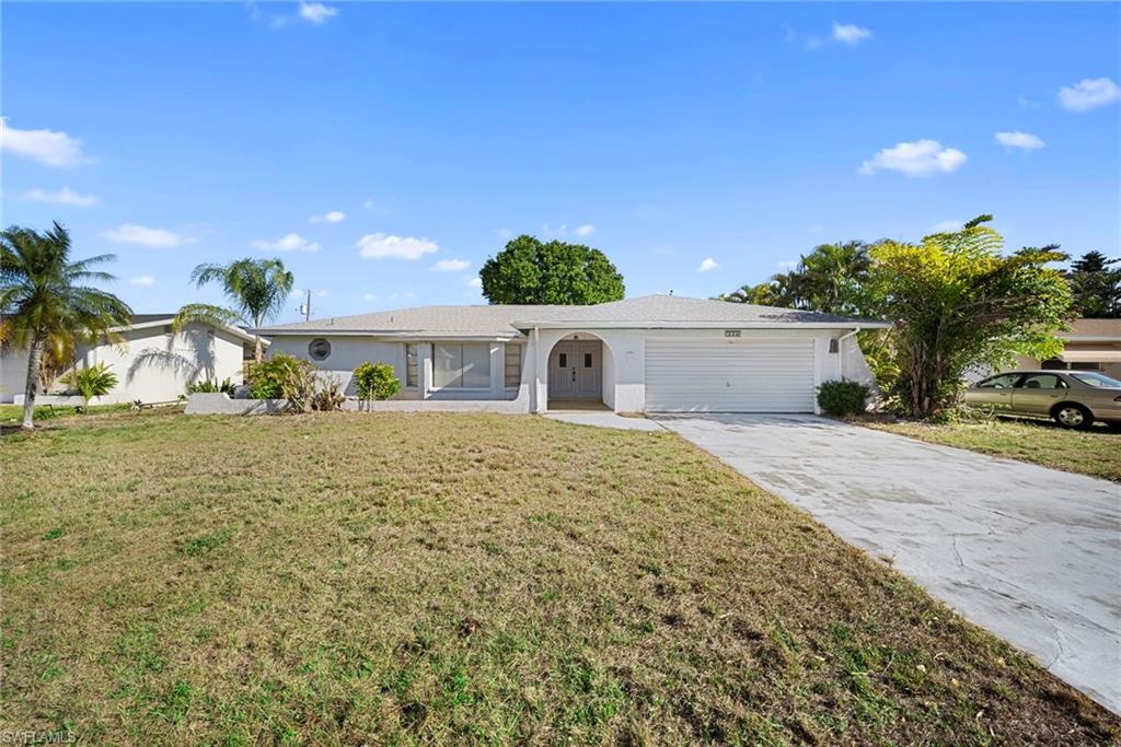 LOCATION, LOCATION! This home must be seen inside to appreciate! Neural paint and finishes thru-out. No HOA! Newer Roof installed just after Ian! Move in and tweek it the way you'd like! Located in the Country Club area off of Palm Tree next to the New City Park that is coming soon! Super UPSIDE POTENTIAL, Location is Key!!! The Seller is looking to sell to an owner occupant! GREAT POTENTIAL FOR A SAVVY HOME OWNER OCCUPANT...check out this floorplan and huge lanai, it is a large 3 bedroom, 2 bath home with 2 car garage with a SPLIT FLOOR-PLAN THAT FAMILIES HAVE BEEN SEARCHING FOR! MOVE IN READY, GREAT BIG KITCHEN, BIG MASTER BATHROOM, LOTS OF SPACE in this Concrete Block Construction with additional DEN with A GIGANTIC SIZED LANAI!!! All City Utility Assessments are Paid in Full. (2019) Ruud A/C system. Walking distance to the NEW PARK THE CITY PURCHASED AND TO THE NEW BIMINI BASIN PROJECT. CLOSE TO The Downtown Cape Coral Restaurants, Entertainment, and Shopping! This expansive floor plan of the home is also tailor-made for your big or blended family, boasting multiple living areas and a GIANT LANAI for the outdoors living, equipped with a fenced yard, and with room to add an inground Pool! If you like the indoors blending to the outdoors area, this has the biggest LANAI, it is HUGE! ...with MULTIPLE SLIDING GLASS DOORS leading to the HUGE LANAI that pocket to open completely, seamlessly blending indoor and outdoor living. The spacious kitchen is well equipped with modern appliances, ample cabinets, and countertop space, along with a charming retro vibe, or move in now and add your own, personal touch. The main bedroom features a large ensuite bathroom with dual sinks, abundant storage, and retro charm that complements its modern cleanliness. With more closets than usual! This is a must see for those that value the privacy of a split plan! Also, for comfort and convenience, there is a large indoor laundry room. Schedule your showing today and discover why this is the perfect place to call home! PLEASE NO OFFERS WITHOUT SHOWING OF THE HOME!