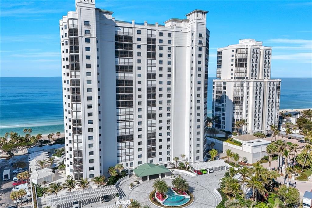 Welcome to the epitome of luxury living at The Biltmore. Residence 1904 is in the private gated community of Bay Colony within Pelican Bay. From this high end-unit, you can enjoy the spectacular sunsets over the beach and gulf, and the sunrises from the east. The living room, dining room and primary bedroom each have direct access to a 12' x 26' balcony.  Additionally, the den/study and two guest bedrooms with en-suite bathrooms, have direct access to a 10' x 33' balcony. The living room enjoys a built-in entertainment center with TV and glass display cabinets, plus a built-in bar with wine cooler and glass display shelves. The den/study contains a built-in desk with overhead storage and cabinets, opposite is a display cabinet with TV and bookshelves.  The chef's eat-in kitchen boasts marble countertops and center island. The three picture windows in the kitchen have magnificent views of the gulf, beaches and sunsets, The room is appointed with high-end brands: Sub-Zero refrigerator w/icemaker, Wolfe cooktop, Bosch dishwasher, and new GE Profile double ovens and a reverse osmosis water system serving the water and ice for the fridge, plus a separate faucet at the sink. Additionally, there is a walk-in pantry with storage shelves and a large wine rack. The Biltmore offers superior management and maintenance teams, plus a 24-hour front desk.  All leading to exceptional and timely service to its residents.