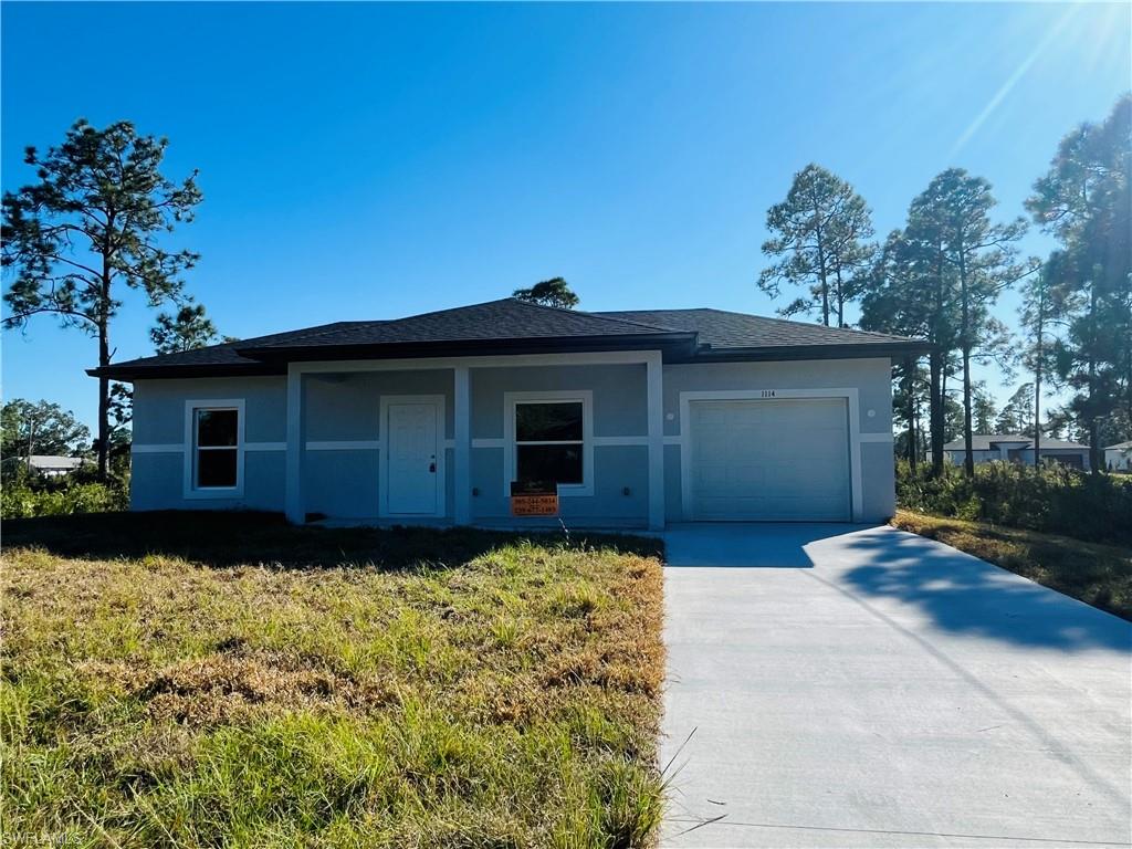 Introducing a BRAND NEW ONE BEDROOM, ONE BATH-ONE CAR GARAGE home in a sought-after location of LEHIGH ACRES. This gem is nestled in a private setting, offering a unique blend of comfort, style, and convenience. The brand-new home boasts Granite Counters, a large island, ample cabinets, and a pantry in the kitchen, creating a chef's dream space. The home is pet-friendly and features beautiful tile flooring throughout, complemented by wood shaker cabinets. It's move-in ready, waiting for you to be the first to call it home. The house is equipped with storm protection-impact windows for added safety. The front open porch and covered rear lanai provide perfect spots for relaxation. The home is competitively priced, making it one of the lowest priced new construction homes in the area. The modern lighting and fixtures add a touch of elegance to the home. Large windows ensure plenty of natural light, creating a warm and inviting atmosphere. The primary bedroom comes with a huge walk-in closet, providing ample storage space. The large backyard offers plenty of room for outdoor activities. This cozy cottage is truly one of a kind in Lehigh Acres. Seller contributes $5k to closing cost. Images may be of a model unit and not of actual property.-Used for marketing purposes.