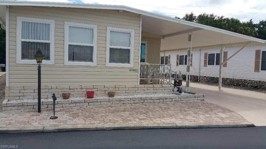 Own a piece of  Paradise with Gulf access and Low Fees! Updated Manufactured Home has  Great Location, Gulf access via Community Boat Ramp, Seven Minutes to Estero Bay, Twelve Minutes to Lovers Key Beach by way of New Pass.  The Front Florida Room has lots of Light and Windows. Open floor plan, remodeled kitchen cabinets, granite island,  granite counters and tiled back splash with  new laminate floors. Guest bath has extra storage, granite vanity and tiled shower/tub. Master Bath is updated with tiled walk -in shower! As a bonus the  home has lots of parking, a private backyard and is close to the pool. A Friendly Community, Clubhouse with activities, water aerobics, tennis, shuffleboard, boccie ball, basketball, pickle ball, kayaking trips, (community Kayaks and bicycles available for residents and families) boat storage compound & lake with fishing Pier. The Community Boat Ramp allows residents to experience Florida's First named Aquatic Preserve - Estero Bay with dolphins, manatees, fish, birds, beaches, shelling, waterfront restaurants, watching the Beautiful Tropical Sunsets at New Pass and back home in 12 minutes! Between Naples & Fort Myers, minutes to Coconut Point Mall.