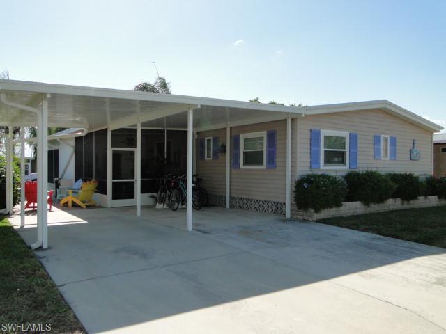 Gulf Access Canal Home in Highly Desirable Bayside Estates.  This artfully decorated waterfront home was featured in the Bayside Tour of Homes after the owner decorated the home.  All Newer Windows with 2 1/2 in. Plantation Shutters, Newer A/C, Fans, Roof Over, Wood Flooring in Both Bedrooms with walk-in closets.  Both bathrooms have been re-done with 18 in. tile.   Kitchen has newer Stove, Disposal and Tile Backsplash.  Outside there's a Screened Lanai Plus a Florida Room.  Double Wide Carport with a Paver Walkway to the Rear Deck & Dock with Boat Lift.  On Gulf-Access Canal only minutes to the Gulf.  This bright and cheery home is Move-In Ready and needs nothing to be done!  One Year Home Warranty provided to the Buyer. NOTE:  There are 4 Personal Items That Do Not Convey.  List Attached.  Agents please read confidential remarks.