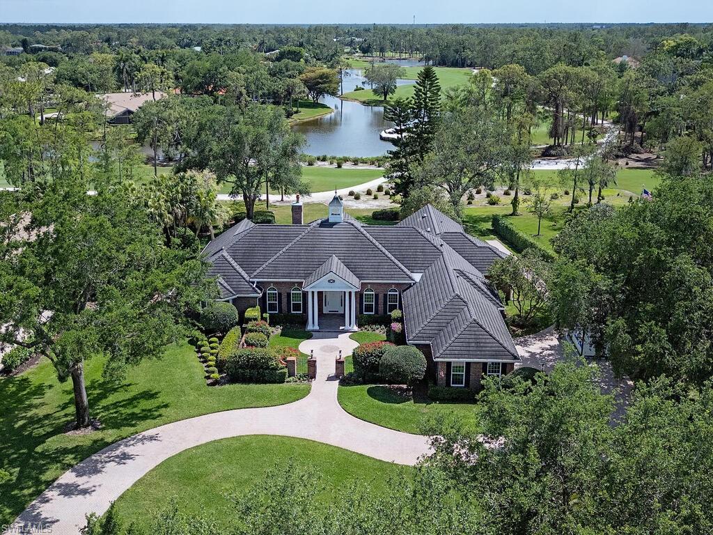 NO WAITLIST FOR GOLF! Perched along Quail Creek's meticulously maintained greens and behind its private gates, this sprawling, recently renovated residence offers timeless appeal and modern luxury while offering an unmatched level of amenities and world-renowned golf. The transitional residence spans across almost 5,000 sq. ft. of living space and offers a total of four-bedroom suites, one of which is a luxurious master suite complete with sitting room, fireplace, and sauna; four full bathrooms and one-half bathroom, library / study, as well as a truly gourmet kitchen and adjacent bar equipped with top-of-the-line appliances. A circular brick pavered driveway leads the way to a quaint private garden that envelopes the home's double door entry. Step inside to soaring ceilings, rich millwork, herringbone floors, and walls of French doors overlooking a resort-style pool and spa. Considered the heart of the home, a truly gourmet kitchen featuring a custom-built, expansive burled wood island with dual dishwashers, sinks, and disposals, make it an ideal space for cooking, baking, and entertaining. The well-designed kitchen also includes ample countertop and storage space, with a built-in pantry, and top-of-the-line Thermador appliances, including a 48-inch gas range, two side-by-side refrigerators and freezers, built-in oven, warming drawer, and a microwave/convection oven. Directly adjacent, a custom bar/coffee station is equipped with an ice maker, beverage cooler, wine fridge, and Miele coffee system. The master suite serves as a true sanctuary, with a spa-inspired bathroom that includes a large sauna, dual vanities, a standalone tub, an oversized, zero-entry glass shower with body jets, multiple adjustable shower heads, and a hand-held body spray. The suite's dressing room, a true masterpiece, offers a large center island surrounded by mirrored cabinetry, providing ample space for both him and her. The expansive 2,800 sq. ft. exterior living terrace was crafted out of shell stone decking and creates the perfect space for entertaining around the stunning saltwater pool and spa - all while enjoying panoramic golf-course views.  Additional features that make this an incredible value include new impact-resistant doors, windows, and garage doors, as well as a stand-out, climate-controlled 288-bottle wine display, and much more. Quail Creek is known for its two Arthur Hills designed 18-hole golf courses, as well as its recently renovated club house that offers multiple options for members to enjoy not only golf, but tennis, pickle-ball, and bocce ball programs, as well as spa services, a Blue Zone fitness center, additional social groups, clubs, activities, and two fabulous dining options.