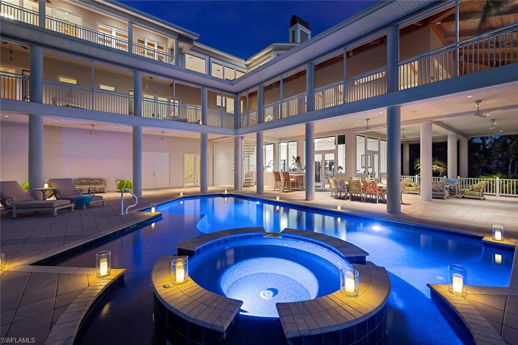 H2881. In an area known for multi-million-dollar homes, this private, gated, built in 2007, family compound on the Gulf is a one-of-a-kind standout, with 5 bedrooms, 5.5 bathrooms and almost 15,000 square feet of indoor/outdoor living space on South Ft Myers Beach. Complete with a custom pool and spa, this magnificent beach retreat is enviably situated on 0.88 acres at the south end of Estero Island offering a rare ownership opportunity to those who treasure privacy and appreciate luxury. In addition to spectacular Gulf views from almost every room, the home’s resort-style amenities and lavish custom appointments place it in a class by itself. While the home’s impressive square footage is designed to flow seamlessly from room to room and from indoors to outdoors, each perfectly planned space has a distinct personality. The L-shaped floor plan is similarly thoughtful. Almost every room opens to one of the home’s expansive screened porches that not only provide sweeping views of the sand and surf, but also facilitates abundant natural light and Gulf breezes. This luxury compound retreat is the ideal place to unwind and enjoy all the best that Southwest Florida has to offer!