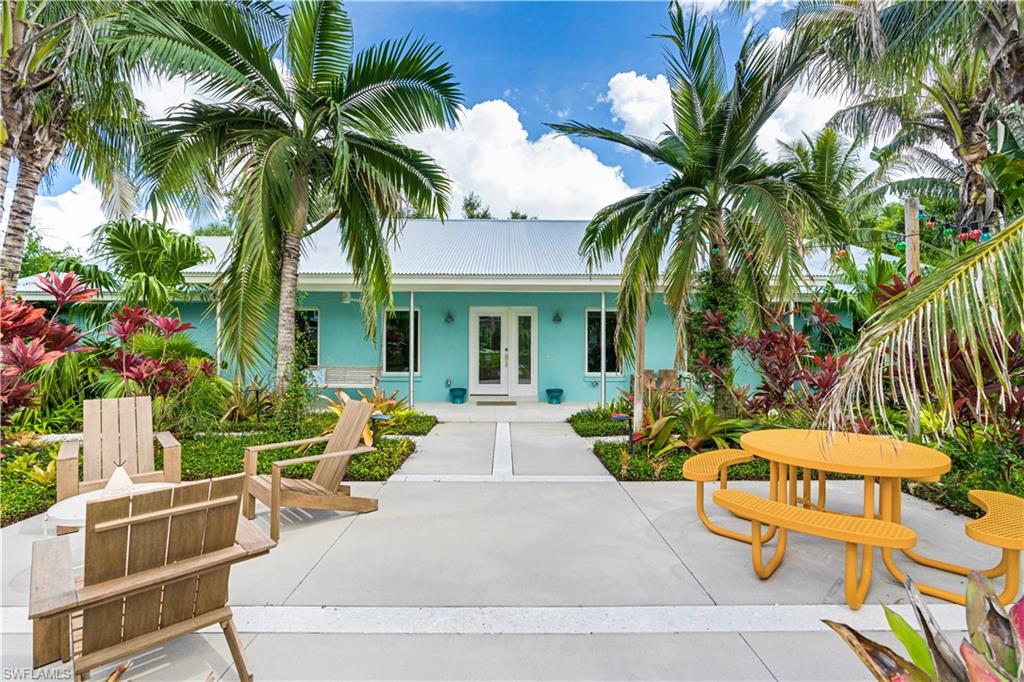 Live at the quiet end of Gasparilla Dr, in a tropical mid-modern beauty in one of McGregor's very best neighborhoods. This fresh and bright 5 BR/3.5 BA has a river view + pedestrian river access.  The 2,380 ft. main house includes Vetrazzo kitchen counters, gas fireplace, and brand-new appliances. New metal roof plus all new impact-resistant windows and doors enhance security and comfort. Many updates include a 2016 HVAC system and complete recent plumbing/wiring overhaul. Huge insulated stand up attic with A/C provides tons of storage.  Attached 700 sq. ft. ground level studio apt boasts a full kitchen with new appliances, full bath, and independent HVAC, making a perfect home office or mother-in-law suite. Outside enjoy a large double carport + golf cart space, many outdoor seating and dining areas, and landscape lighting. The 17x35 deep saltwater heated pool refreshes year-round.  Landscaped grounds provide privacy with granddaddy oaks, palms, mango and other tropical fruit trees. Oversized driveway, extra parking spot, and discreet large boat/RV parking add convenience. This house weathered Hurricane Ian without windstorm claims. Come explore this one-of-a-kind tropical haven!