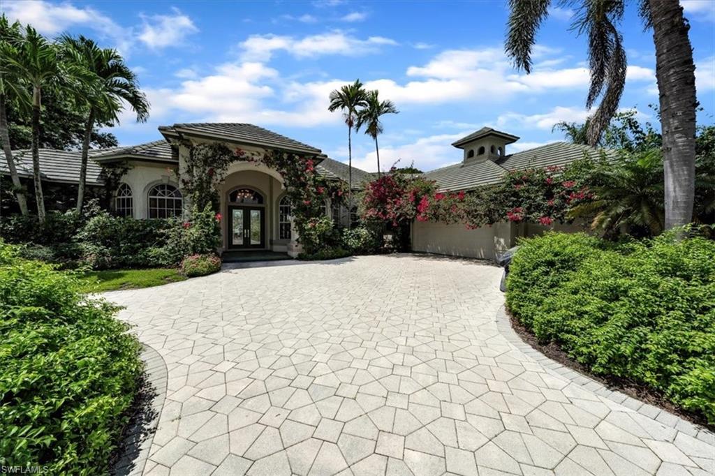 Grey Oaks Golf & Country Club – Premier Cul-de-Sac Estate
This estate residence is perfectly situated on one of the most coveted cul-de-sac lots in all of Grey Oaks Golf & Country Club. With approximately 210 feet of rear frontage, it offers expansive, wide-angle views of shimmering water and the 6th green of the Palm Golf Course, all enhanced by highly desirable southern exposure. Designed for elegance and comfort, the home features soaring ceilings and serene views from the large master suite, great room, formal dining room, kitchen, and breakfast room. The private master wing includes a spacious office, oversized walk-in closets, and a luxurious master bath. The guest wing offers four spacious bedrooms and two full baths, ensuring privacy and comfort for family and friends. Ready for a new owner to put their own tastes and improvements to an estate home with an unreplaceable view. Grey Oaks is consistently ranked among the top private golf communities in the country—not only for its ideal Naples location and pristine course conditions, but also for its exceptional amenities, including three championship golf courses, world-class tennis and pickleball, state-of-the-art fitness facilities, and a stunning clubhouse. The community’s location is unmatched, just minutes from the white sand beaches of the Gulf of Mexico and the vibrant heart of downtown Naples, where an extraordinary selection of fine dining, boutique shopping, and charming walkable streets await.
