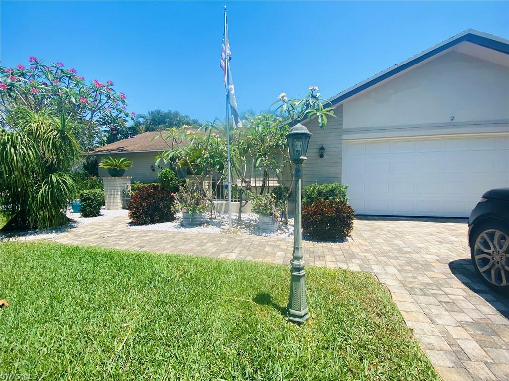 Very well maintained Rutenberg home on a palm tree lined street, the home is located on a beautiful oversized lot on a cul de sac with great privacy and water view and a very old, big Oak tree in the back yard!   The landscaping will be the first to catch your eye with a paver driveway and amazing fruit trees throughout the property including mango, banana, peaches, grapefruit and many more.  As you enter the front door the view of the private pool and expansive yard takes your breath away.  The flooring has been redone the kitchen has been remodeled, the bathrooms updated, new hurricane windows as of 2015 along with hurricane shutters in 2018, newer A/C and HVAC unit, a full house generator/propane system, a gorgeous saltwater pool with solar heat.  Privacy fencing along with a workshop/shed there is also separate well irrigation for all the beautiful landscaping and trees.  This home is a must see.  It will again be on a golf course that has been approved along with a Marina.  The neighborhood will become gated and the existing homes are grandfathered in so no HOA for this home even with all the amenities.  Take a look at this home you will fall in love!