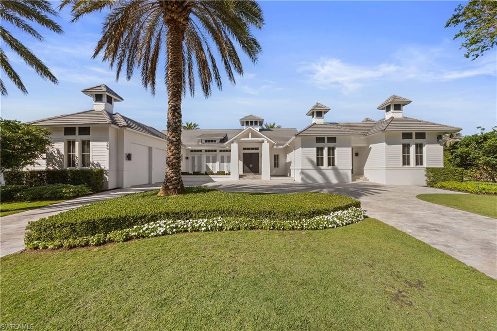 Discover the essence of refined waterfront living in this extraordinary Park Shore residence—where architectural elegance meets the glamorous boating lifestyle. Perfectly positioned on one of Naples’ most coveted bays, this home captures breathtaking wide-water views and a seamless connection between indoor and outdoor living.
A luminous entryway sets the tone, opening to a dramatic great room with soaring ceilings and floor-to-ceiling vistas that draw your gaze to the sparkling infinity-edge pool and your yacht, gracefully docked on a private 20,000 lb. lift. The expansive travertine terrace spans the width of the home, designed for sophisticated entertaining and tranquil lounging under the Florida sun.
Inside, every detail speaks of luxury and precision. Rich wood flooring pairs beautifully with sleek white cabinetry, Silestone countertops, and professional-grade JennAir appliances. The serene primary suite is a private sanctuary featuring three custom-organized closets and a spa-inspired bath offering the ultimate in relaxation.
A thoughtfully designed split-bedroom floor plan ensures privacy for guests with three spacious bedrooms, two full baths, and a versatile bonus room—ideal for a home office, gym, or media lounge—complete with a built-in breakfast bar. Imported Italian lighting adds a contemporary glow, while practical luxuries such as an oversized air-conditioned 2+ car garage (with room for a lift), a spacious laundry suite, and newer mechanical systems ensure modern comfort.
Set on a premier street with quick access to Venetian Village, Waterside Shops, and the pristine sands of Park Shore Beach—and just a seven-minute boat ride to the Gulf—this residence embodies the very best of Naples’ coastal sophistication.
A waterfront masterpiece where elegance, comfort, and lifestyle converge.
