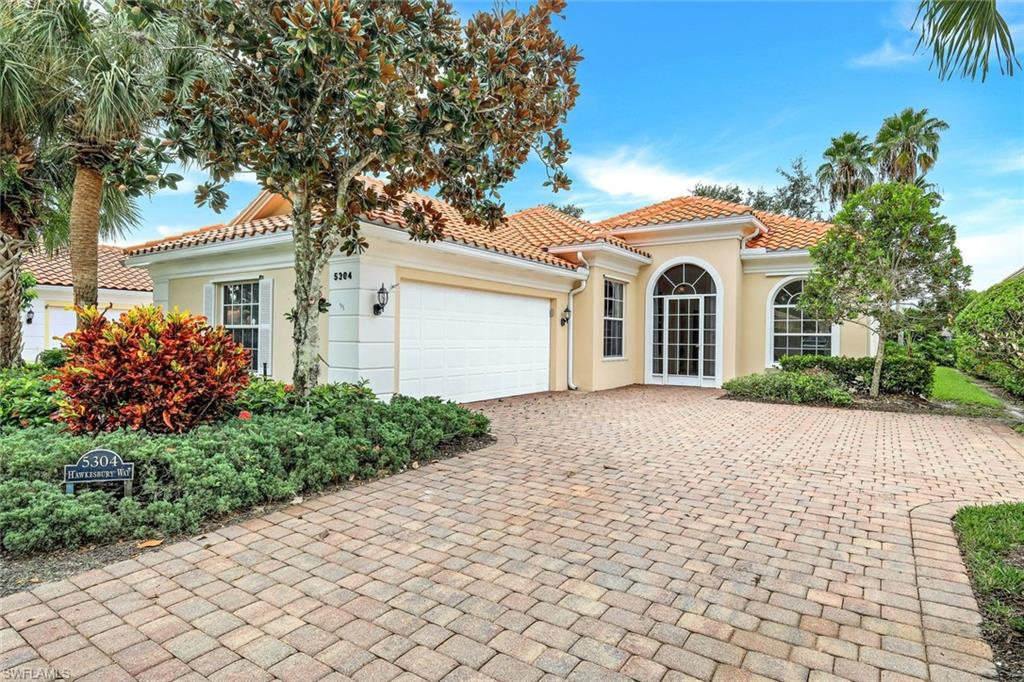 THIS IS IT! Your easy-care Naples home…is Move-in Ready with a **NEW ROOF**Sun-filled, Oakmont Model Home is lovingly maintained, this popular Open Plan LAKEVIEW 3 Bedroom, 2.5 Bath Oakmont with 2 Car attached Garage offers Privacy and Tranquility. The 12 Foot Volume Ceilings and the popular Open Kitchen is perfect for entertaining. Extras include a newer Washer & Dryer, upgraded Fans and Light Fixtures, Central Vacuum and Security System. Relax on your Easy-Care Screened Lanai overlooking the tranquil lake knowing that without a pool you won’t be saddled with extra Insurance or weekly pool maintenance fees. Located just a short stroll to the many amenities offered at Town Center. This exceptional buy includes Lawn/Landscaping/Irrigation Care, HDTV & High Speed Internet in the LOW FEES. IslandWalk has amenities galore which include a Town Center with 8 Har-tru Tennis Courts, Fitness Center, Bocce Courts, Restaurant, Gas Station, Car Wash, Hair & Nail Salon and Post Office. Come & make this your perfect home to Work, Play and enjoy Naples lifestyle and make this Gem your Oasis in Paradise!
