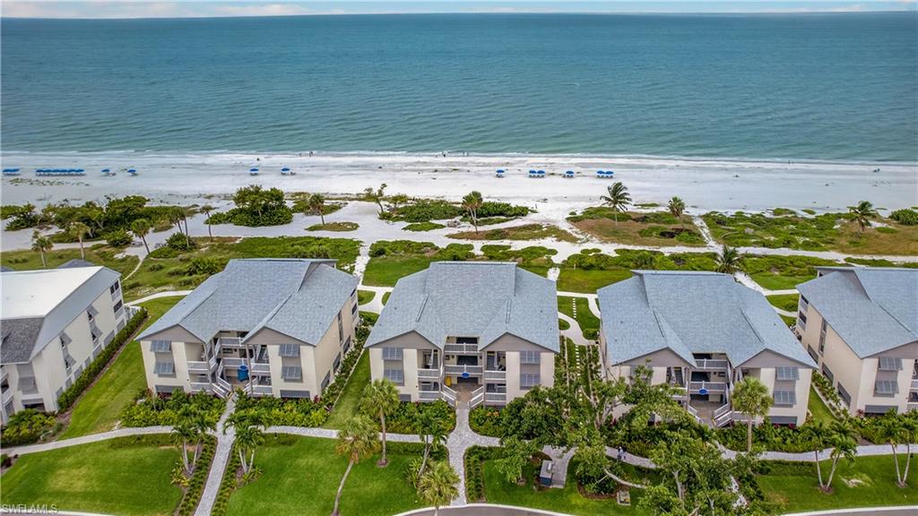There are beachfront properties, and then there are opportunities that exist in a category all their own. On the first floor within the exclusive Cottage Colony West at the iconic Casa Ybel Resort, 2255 W Gulf Drive #127 offers an extraordinary chance to own a piece of Sanibel Island’s desired Gulf-front coastline, where breathtaking sunsets, panoramic water views and resort-style amenities create the ultimate island retreat. Along 23 acres of pristine beachfront, this beautifully updated turnkey residence captures the essence of luxury coastal living. Expansive impact-rated windows and sliding glass doors fill the home with natural light while framing stunning Gulf of Mexico views. The open-concept floor plan blends comfort and sophistication, with spacious living and dining areas flowing seamlessly to a private screened lanai, an idyllic setting for morning coffee, evening cocktails, or simply enjoying the sights and sounds of the shoreline. The renovated kitchen showcases white shaker cabinetry, quartz-style countertops, stainless steel appliances, designer shelving, and coastal-inspired finishes that ideally complement the island setting. The spacious bedroom retreat offers warm wood-style flooring, plantation shutters and a serene atmosphere designed for relaxation, while the updated bath features contemporary finishes and polished fixtures. As a first-floor residence, the unit enjoys quick access, abundant natural light and front-row Gulf views. Just outside your door, Casa Ybel Resort offers direct access to one of Sanibel’s celebrated stretches of sugar-white sand beach, along with a beachfront pool, tennis and pickleball courts, on-site dining, scenic biking and jogging paths, and lush tropical grounds. This property also presents an exceptional investment opportunity through Casa Ybel’s professionally managed on-site rental program. The combination of direct beachfront location, resort amenities, strong vacation rental demand, and Sanibel Island’s enduring desirability creates a rare opportunity for personal enjoyment and income potential. Whether you're searching for a luxury beachfront escape, a potential income-producing vacation property or your Gulf-front sanctuary, this exceptional residence delivers the best of Sanibel Island living.