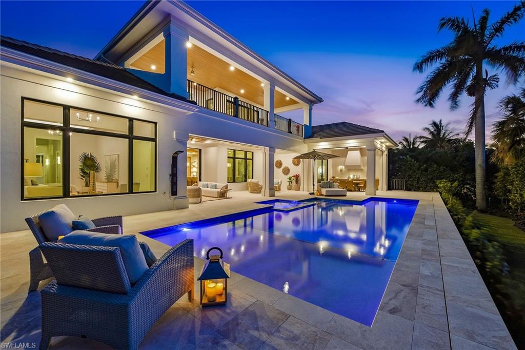 Welcome to 529 Neapolitan Way, a newly constructed residence by Borelli Luxury Homes centered around gathering, hosting and coastal living in beautiful Park Shore. Even better, this residence exceeds current FEMA requirements, situated at an impressive 12-foot elevation. Offered furnished, this home is curated for immediate enjoyment, where natural light filters through expansive living areas, drawing attention to the central gathering spaces where conversation and connection take shape. The kitchen is designed as a functional workspace and a visual anchor, featuring waterfall-edge quartzite surfaces, warm oak cabinetry with metal and glass accents, and a full suite of Wolf and Sub-Zero appliances, including gas cooking. A dual-zone wine refrigerator and additional refrigeration drawers are seamlessly integrated, allowing for effortless hosting. Nearby, the living room is framed by a gas fireplace feature wall, while a glass-front, climate-controlled wine vault creates a striking focal point that invites discussion and display. The first-floor primary suite offers a private retreat that reflects the experience of a five-star hotel. The bedroom includes a dedicated sitting area, elevated ceiling heights and abundant natural light. The expansive en-suite bath is beautifully finished with refined materials and a layout designed for daily comfort, complemented by two custom walk-in closets that provide scale and organization. Guest accommodations are arranged to provide comfort and privacy across two levels. Two guest suites are positioned on the main floor, while the second level introduces an additional layer of livability with two more suites and a spacious social room. Complete with a wet bar and access to a balcony, this upper-level retreat offers a secondary gathering space that transitions easily to the whims of its guests. Outdoor living extends the narrative of the home, where the covered lanai becomes a natural extension of the interior. A gas fireplace and full summer kitchen set the stage for open-air dining and conversation, while the large pool and spa are framed by a landscaped backdrop designed to enhance privacy. Positioned within Park Shore, this residence includes access to the private beach park and is near the waterfront shops and dining of Venetian Village. For those seeking a boating lifestyle, eligibility for boat slip ownership or lease at the Park Shore Yacht Club offers an additional layer of access to the Gulf. A three-car garage, private elevator and full-home generator complete the offering. This residence presents a cohesive living experience, where architecture, design and location come together to support a lifestyle defined by connection, comfort and coastal access.