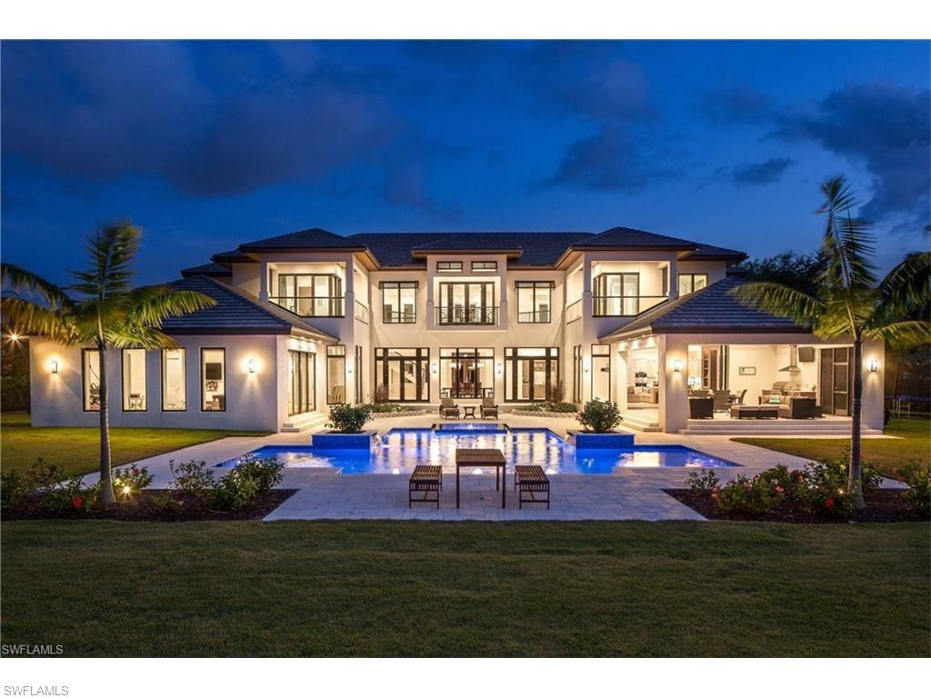 Situated on a PREMIUM 1 acre LAKEFRONT lot, this 2016 Custom built home is the epitome of quality & design.  The Transitional style showcases the expansive water views & the infinity edge pool from almost every room.  Outfitted with top of the line finishes & materials & designed by an award winning builder, this 4 bedroom + den, 6 bath estate home is elegant yet casual & relaxed.  All windows & doors are impact resistant & low E insulation so that the house cools & heats efficiently.  The chefs kitchen boasts an over sized island with stainless steel Wolf & Sub Zero appliances & modern Kohler fixtures along with an Electrolux central vac & sweep system.   The 1st floor features a state of the art surround sound private theater along with a completely separate game room to maximize entertainment possibilities.   Accessible by a grand staircase or private elevator, the 2nd floor Master suite features breathtaking views of Warbler Lake.  The generous Master bath has dual vanities, a free standing tub & an immense multi headed walk through shower.  The split 4 car garage allows for optimal storage for the car aficionado.  Located in the heart of Pine Ridge, this home is move in ready!