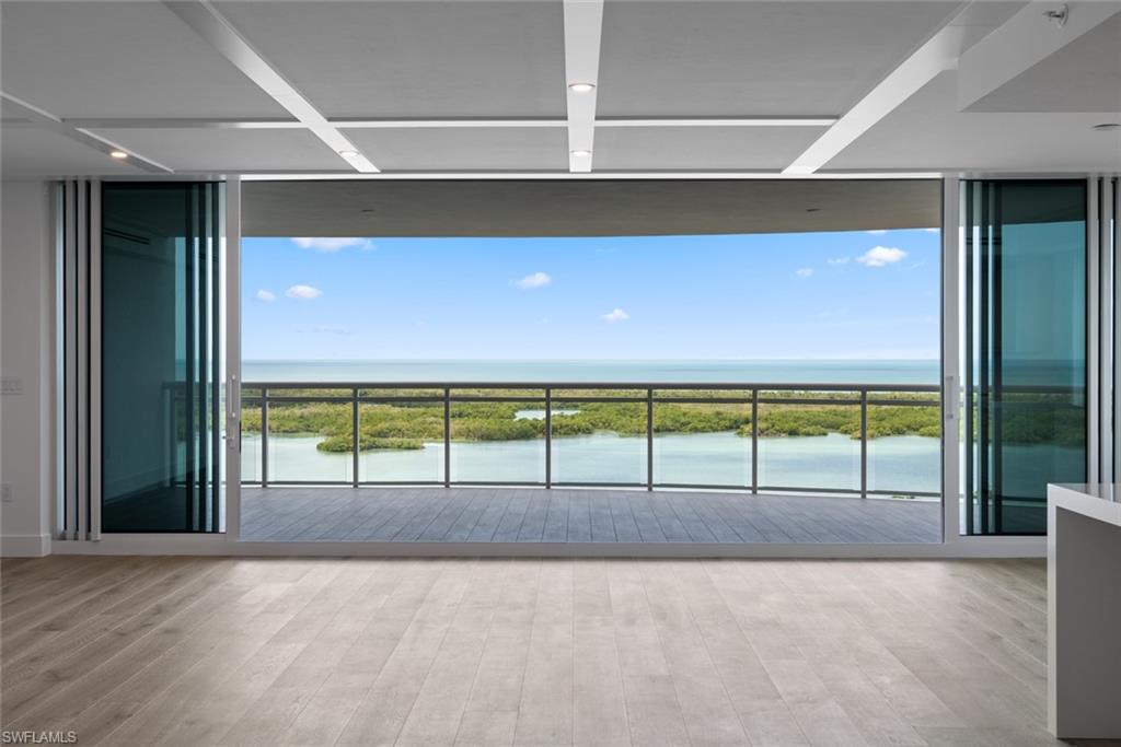 Luxury awaits! Immerse yourself into the quintessential lifestyle at Kalea Bay. Private elevator entrance to the spacious 4 bed, 4 bath end unit with breathtaking unobstructed gulf and bay views. This unit includes countless upgrades and finishes that are desirable to any buyer. A chef’s kitchen includes upgraded thazos quartz countertops with spacious butler’s pantry. Custom upgrades include Wolf Induction, Contemporary black glass hood, Sub-Zero wine cooler that holds 100+ bottles, Quartz thazos waterfall edge island, and upgraded custom woodwork ceilings throughout unit. Primary suite with ultra clear glass shower, upgraded rain shower feature, and opulent views of the gulf. Ammenities include rooftop terrace/pool with an open-air fitness center and sky lounge. Experience the exquisite 5 star resort-style amenities in the luxury of your own neighborhood. Two open-aired bars, 3 pools, state-of-the art 14,000 sq foot wellness center, upscale & casual dining, tennis/pickleball courts, guest cottages, teen lounge/kids room.