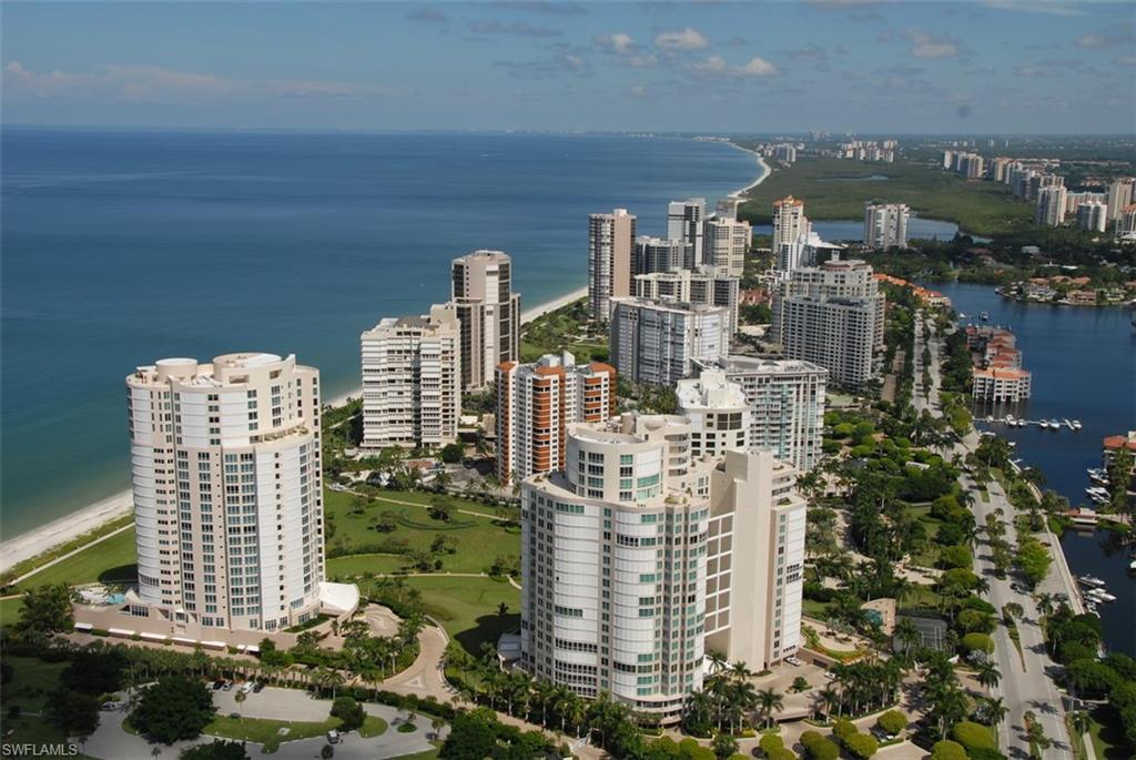 BREATHTAKING 17th Floor Estate boasts stunning Beach, Bay and Venetian Village Views (Village views are particularly beautiful in the evening).   Wonderfully designed floor plan with ten foot ceilings, eight foot doors, floor to ceiling windows, chef's dream kitchen with gas cooking, butler's pantry, morning room, family room, formal living and dining rooms, four bedrooms plus den and four full and two half baths, media room, library, guest suite with its own private kitchen!  Building provides secure private elevators into homes, large conference room, fitness center (which is being enlarged and fitted with state of the art equipment), steam and sauna rooms, chair/umbrella services provided on the beach, two guest suites for overflow guests. First Class Amenities in this exclusive building and directly across the street at Venetian Village.